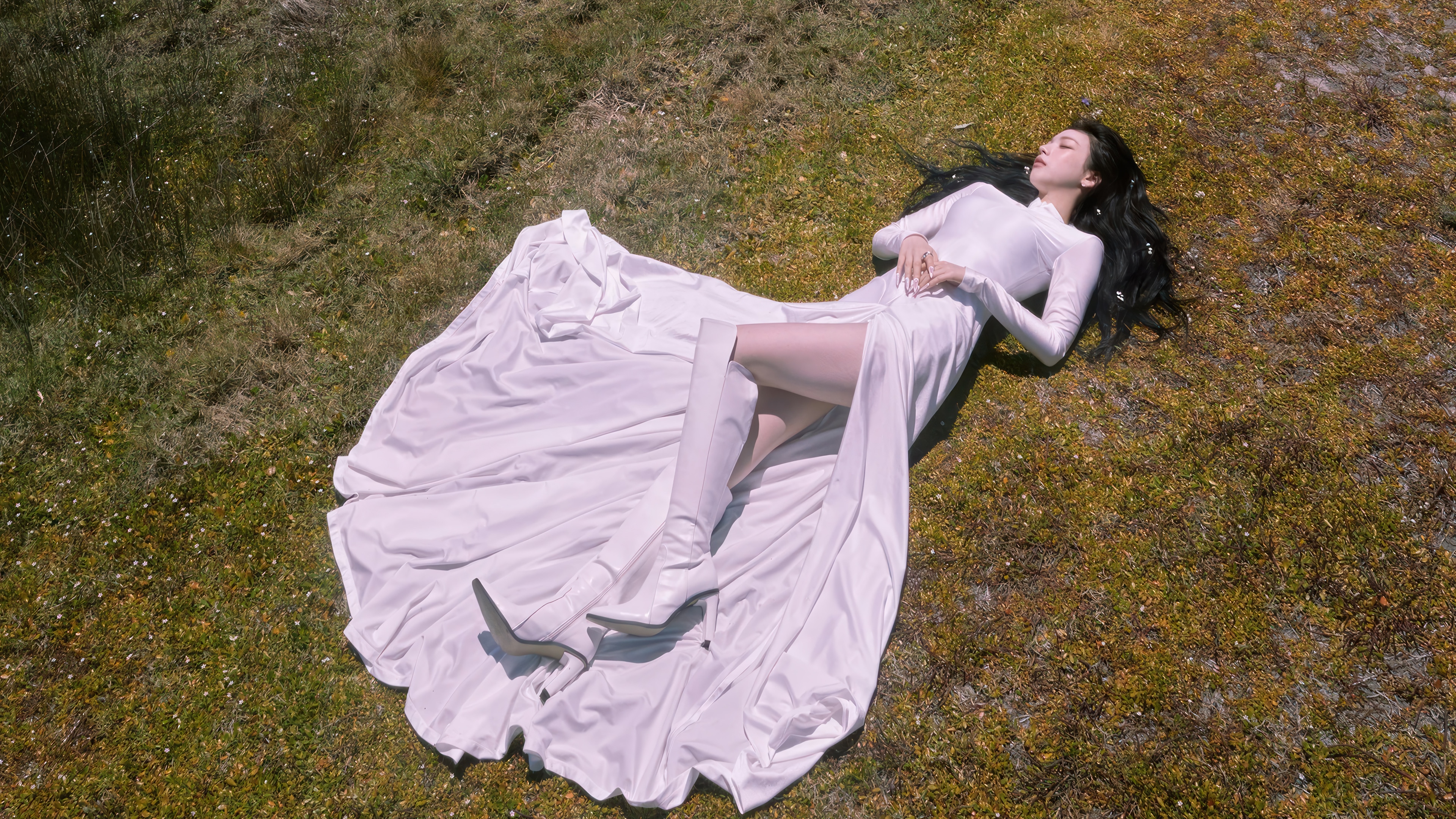 Karina in a white dress lying on grass HD Wallpaper