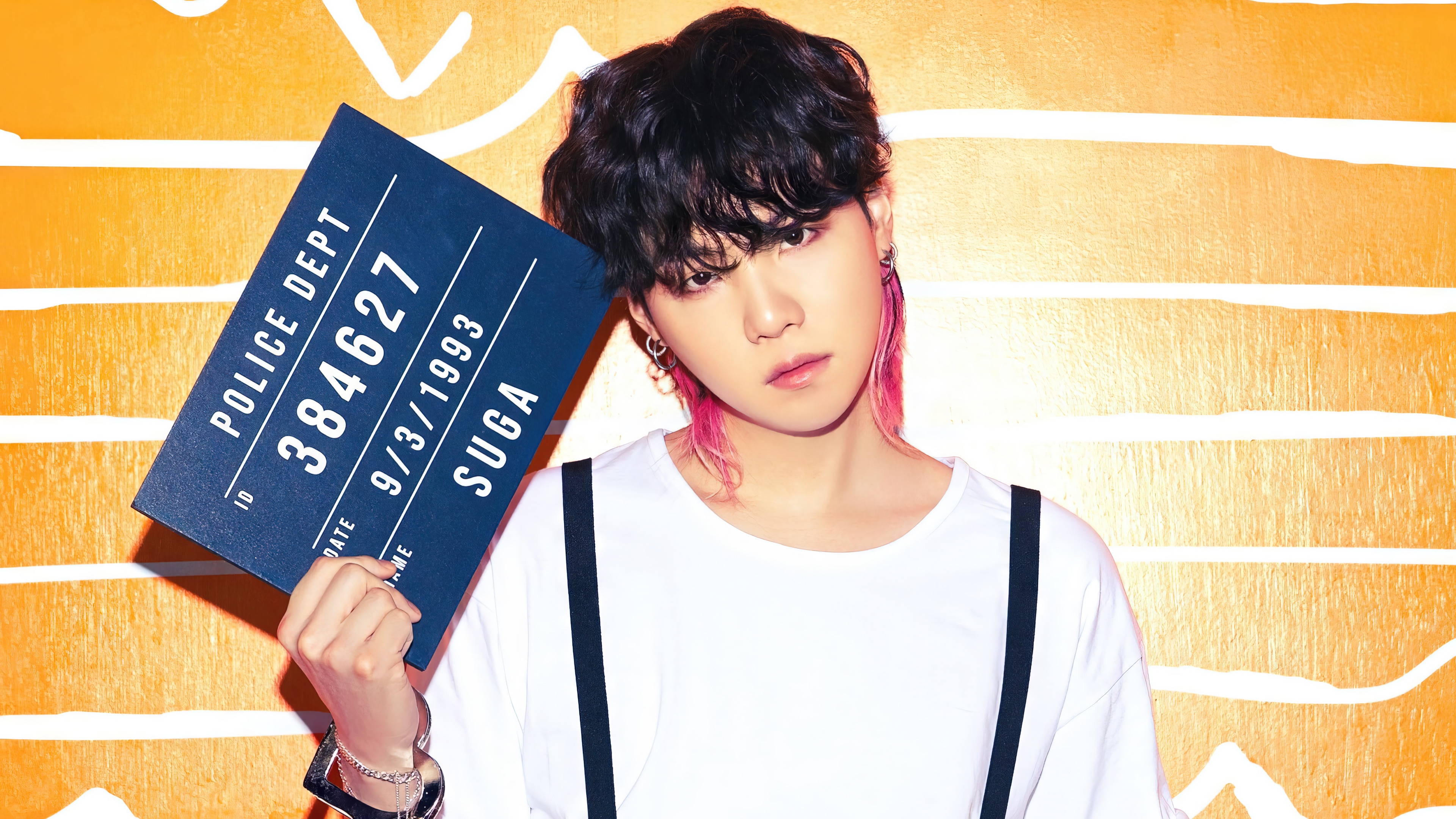 Suga of BTS holding a police mugshot sign HD Wallpaper