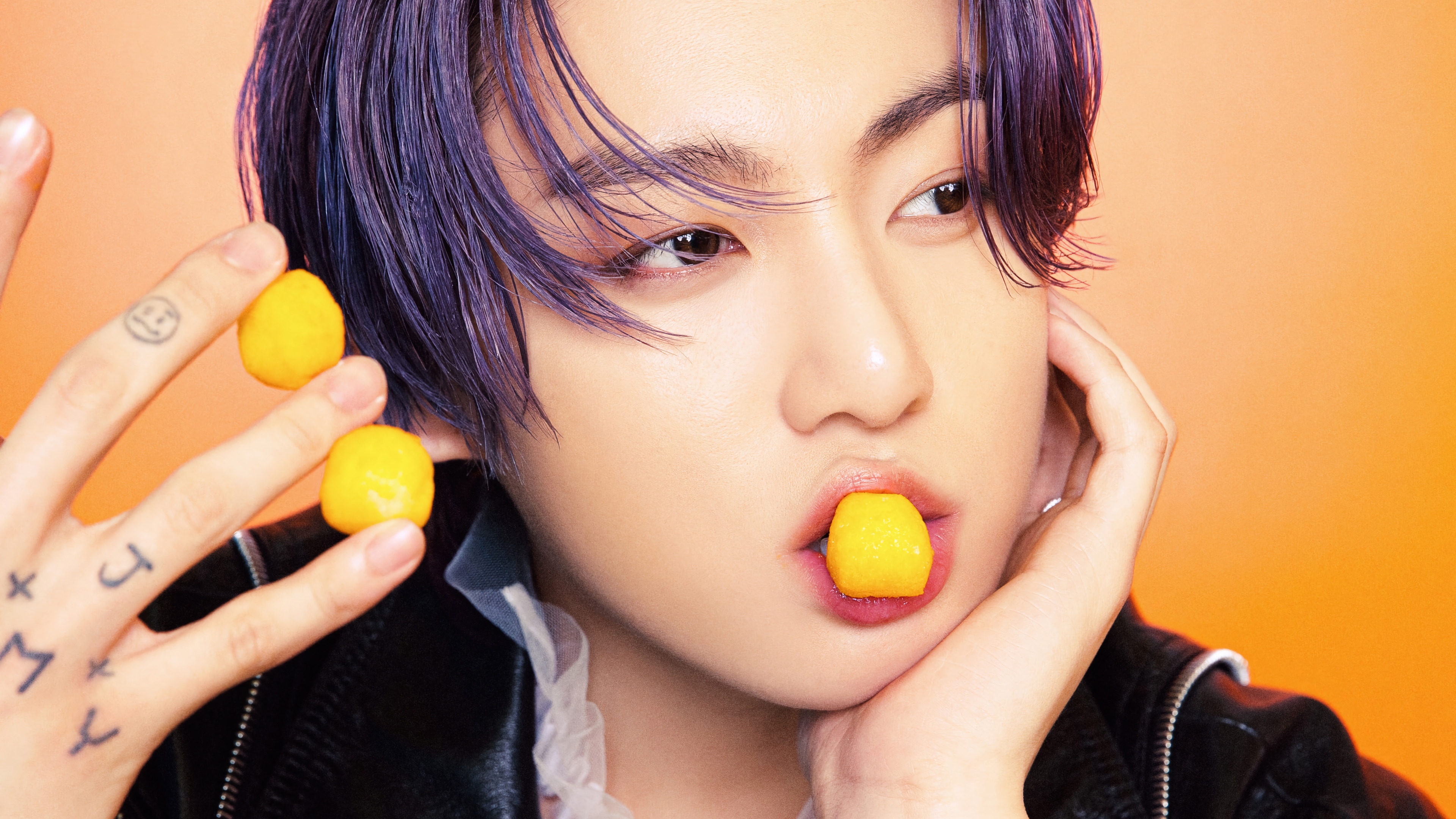 Jungkook of BTS with purple hair and yellow candies HD Wallpaper