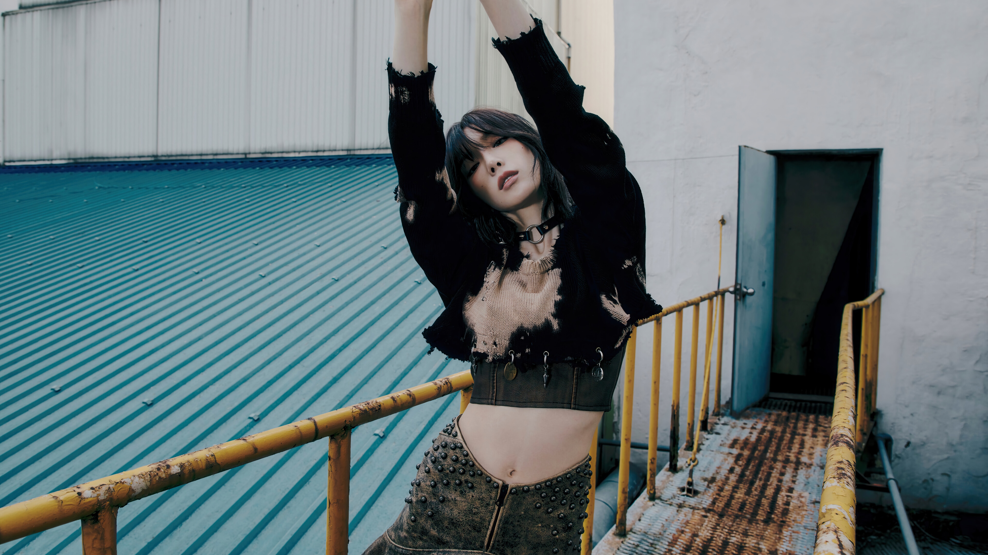 Taeyeon in a black top and studded skirt HD Wallpaper