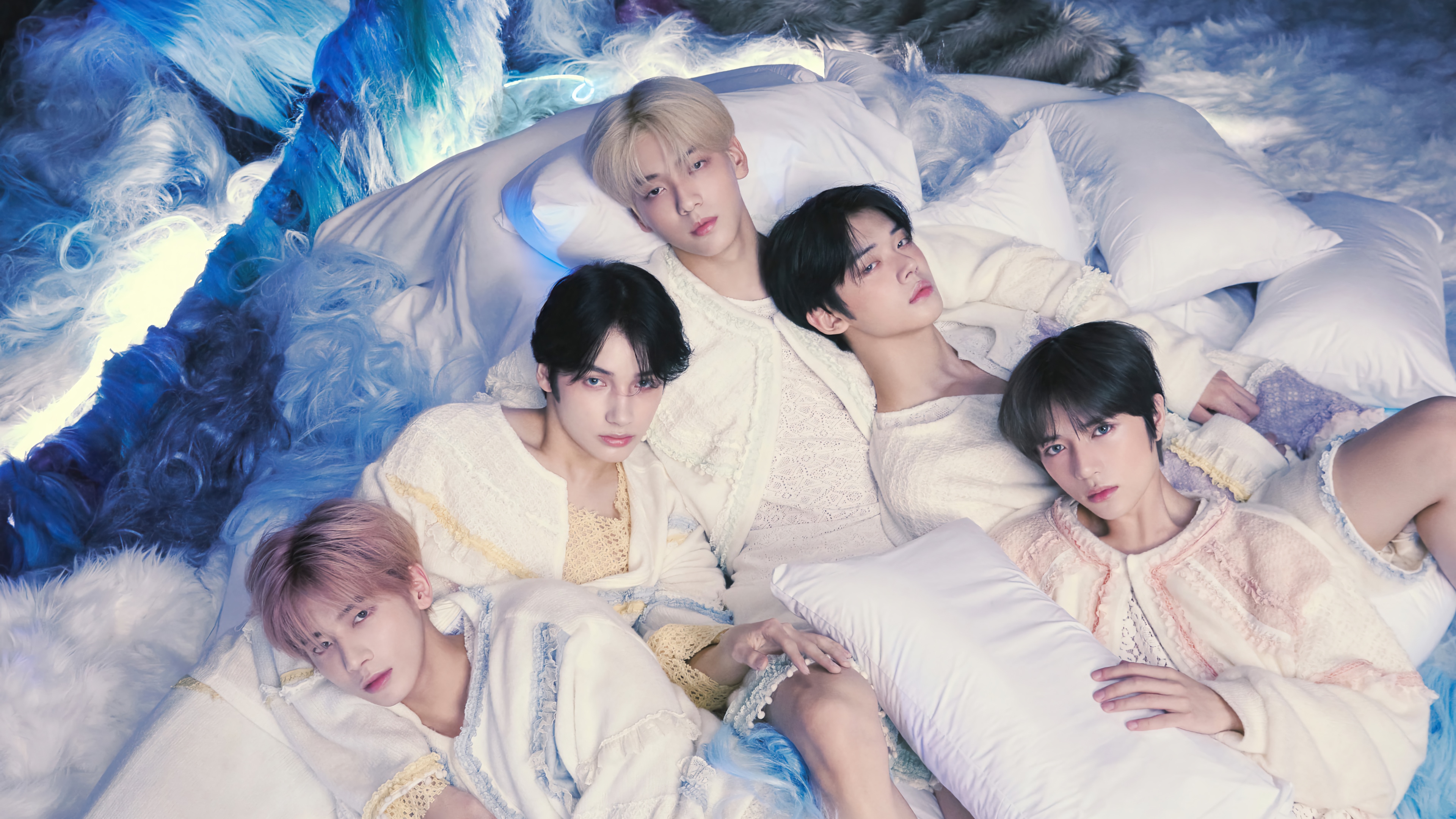 TXT members lying on pillows HD Wallpaper