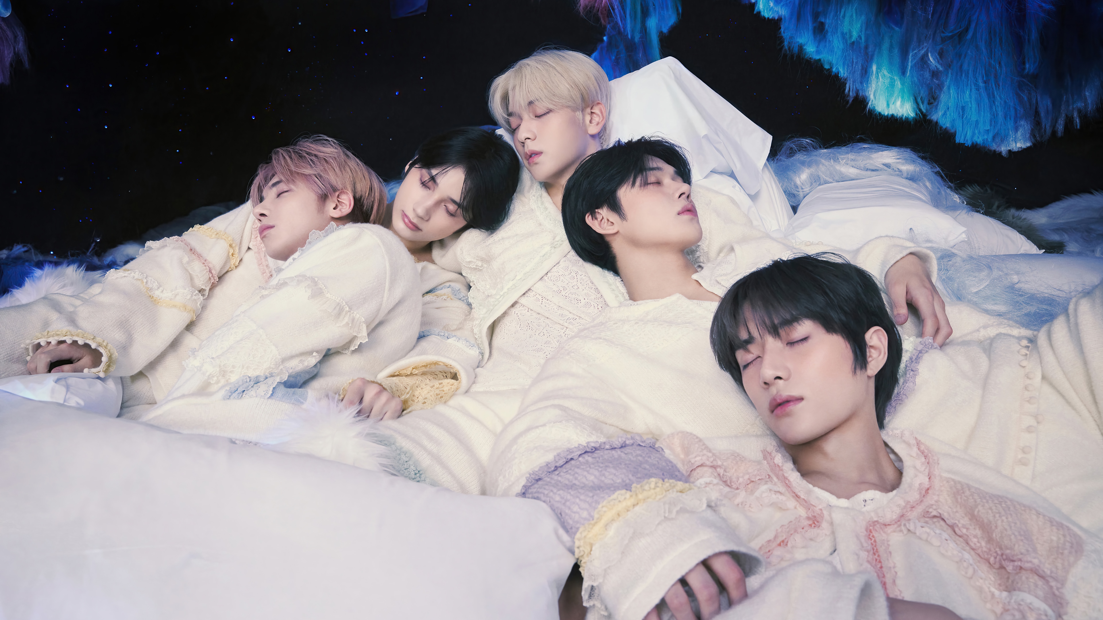 TXT members sleeping in a dreamy setting 4K HD Wallpaper