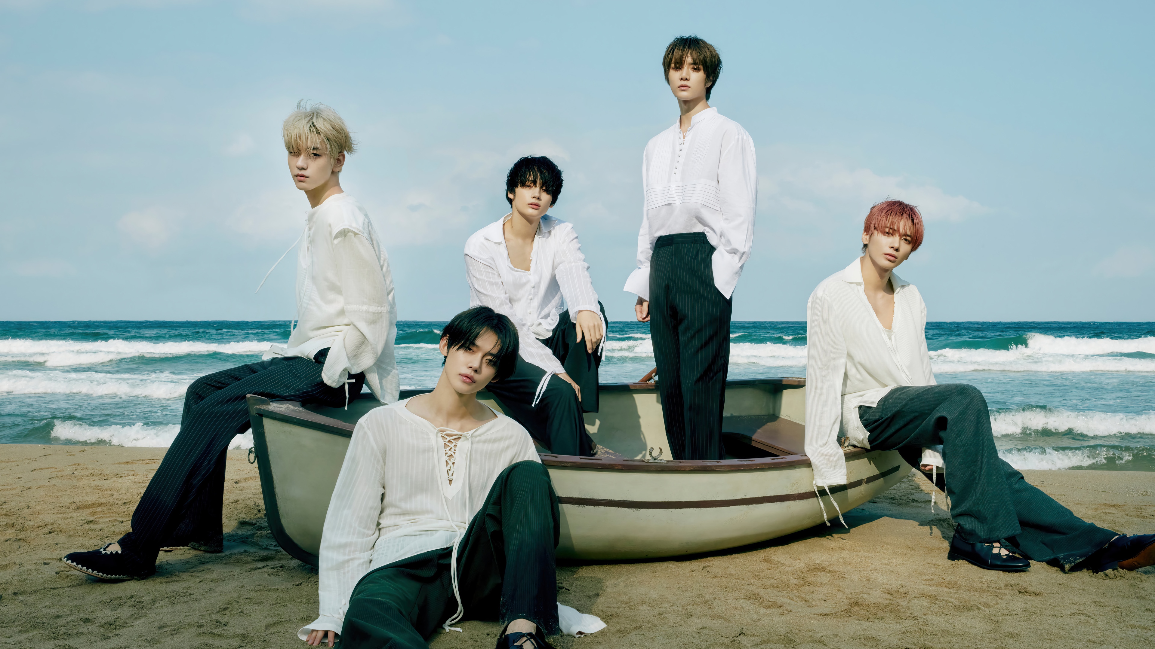 TXT members in a boat on the beach HD Wallpaper