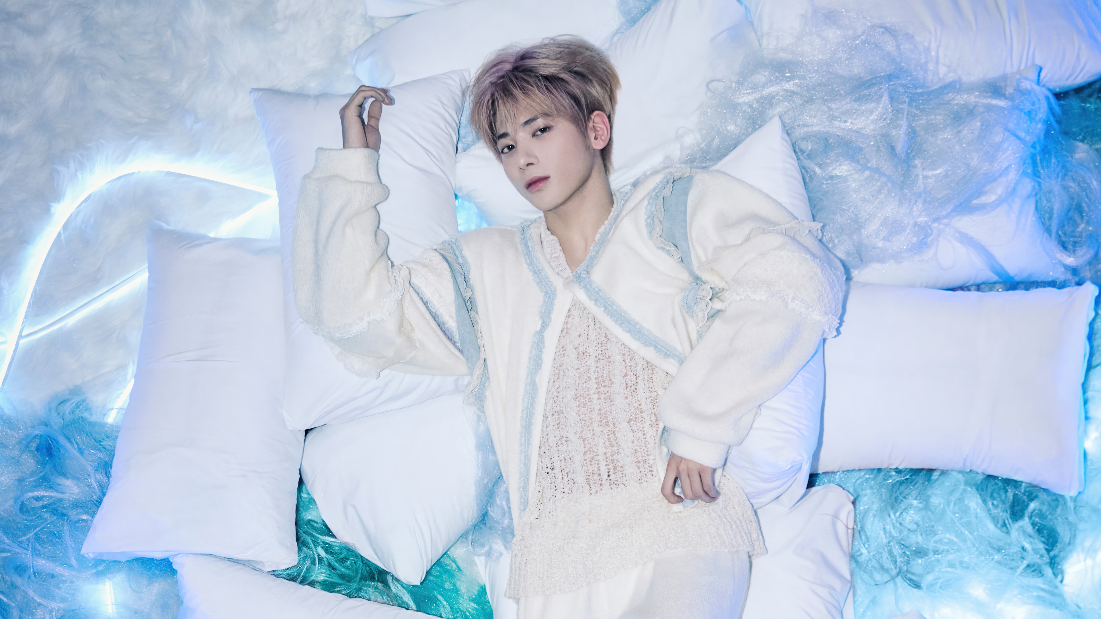 Taehyun from TXT lying on pillows HD Wallpaper