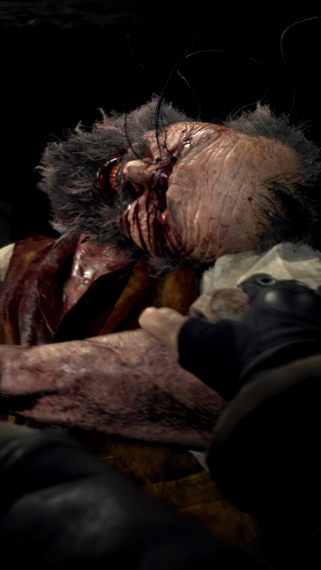 Resident Evil 4 Remake: Gruesome close-up of a bloody victim HD Phone Wallpaper