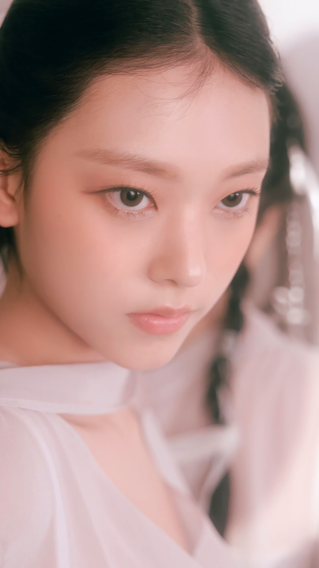 Haerin from NewJeans in a soft, ethereal portrait HD Phone Wallpaper