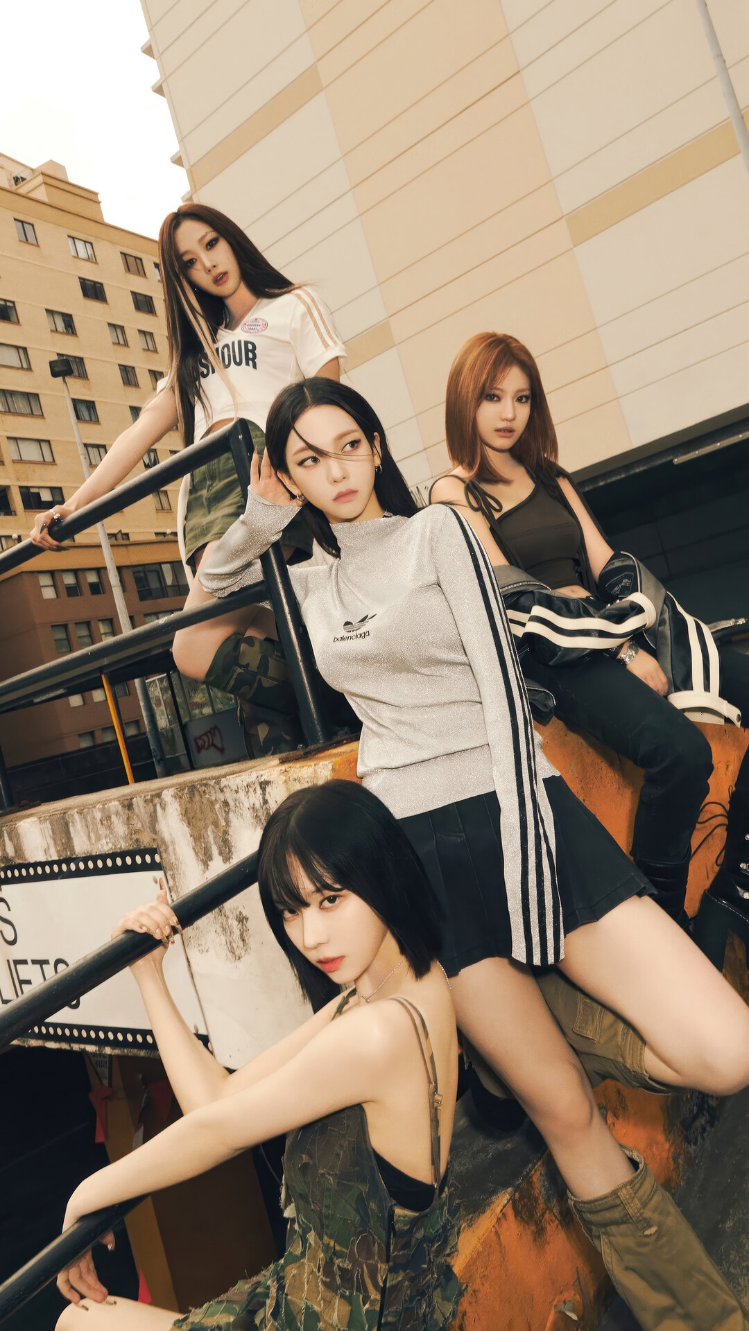 Aespa members posing on stairs with urban background HD Phone Wallpaper