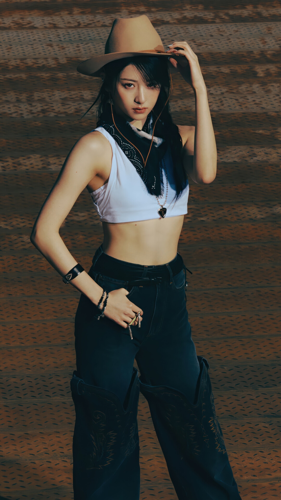Huh Yun-jin in a cowboy hat and white crop top HD Phone Wallpaper