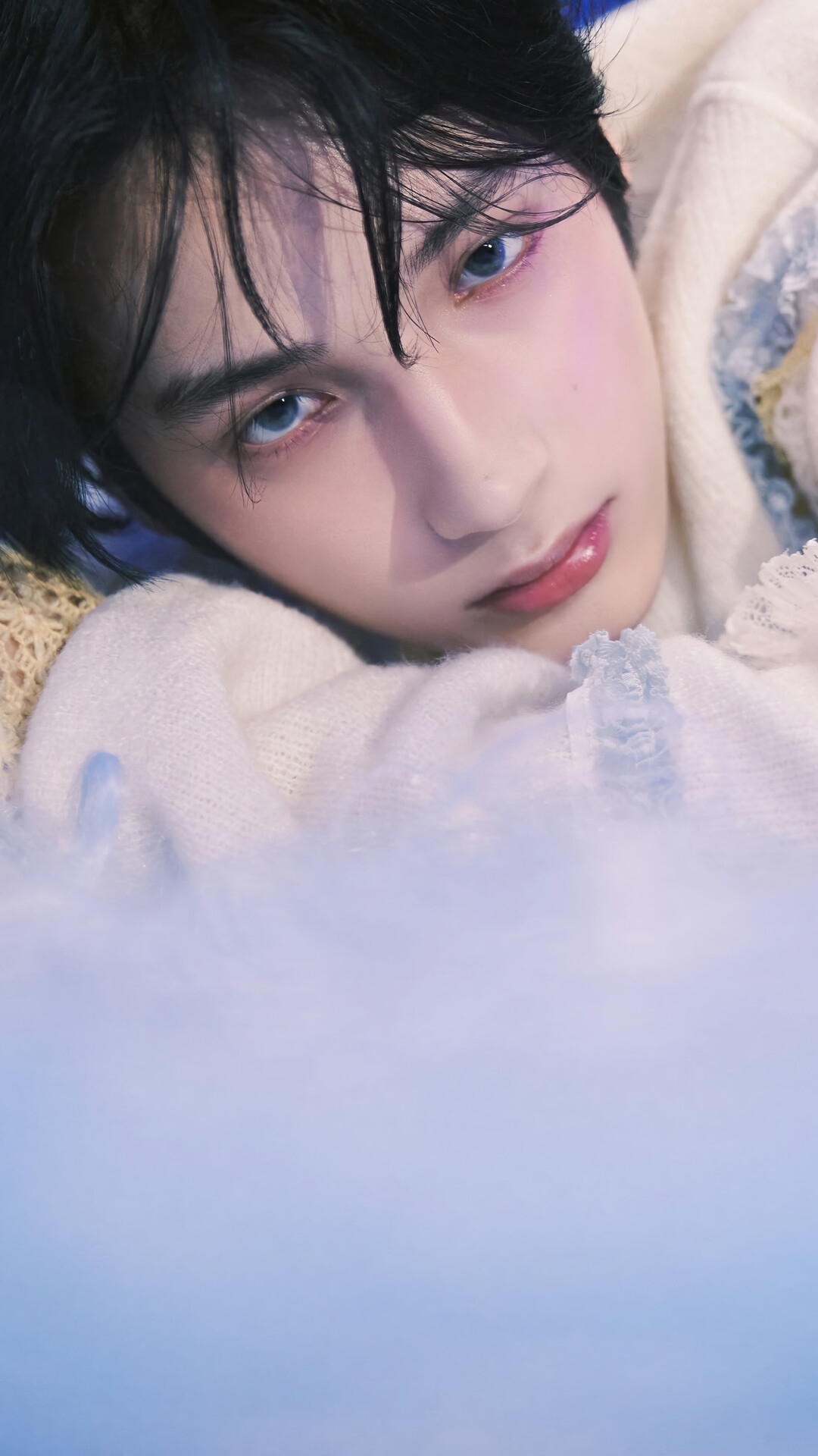 Huening Kai of TXT wearing a white sweater HD Phone Wallpaper
