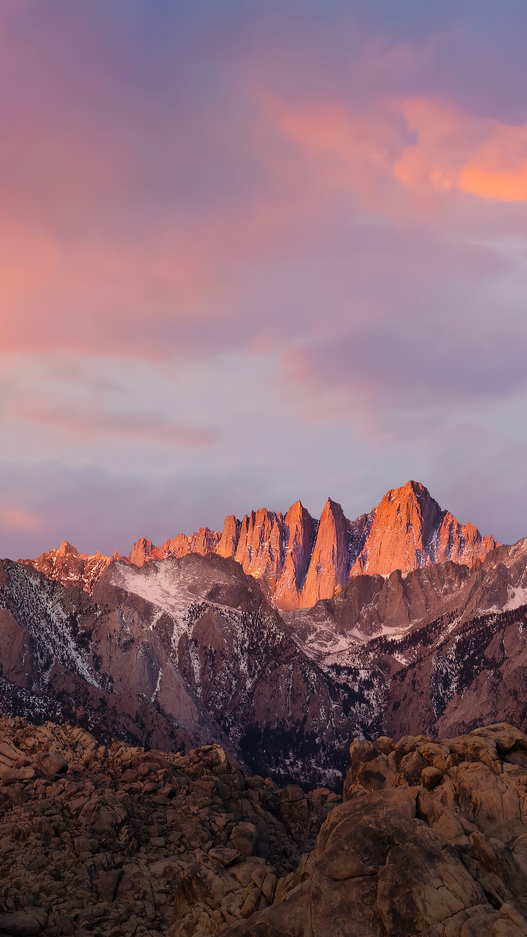 Mountain range illuminated by sunset HD Phone Wallpaper