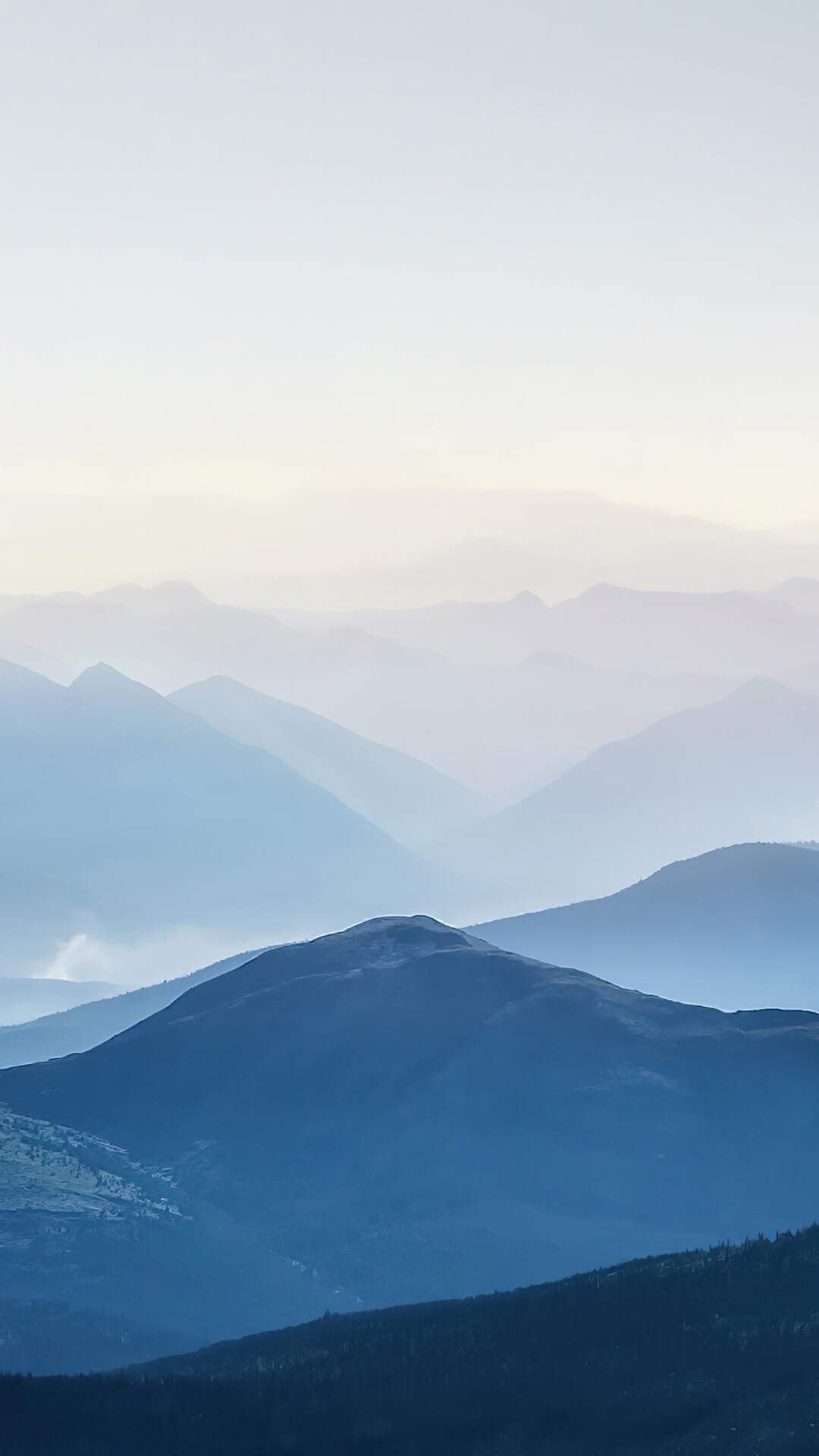 Layered blue mountains fading into the sky HD Phone Wallpaper