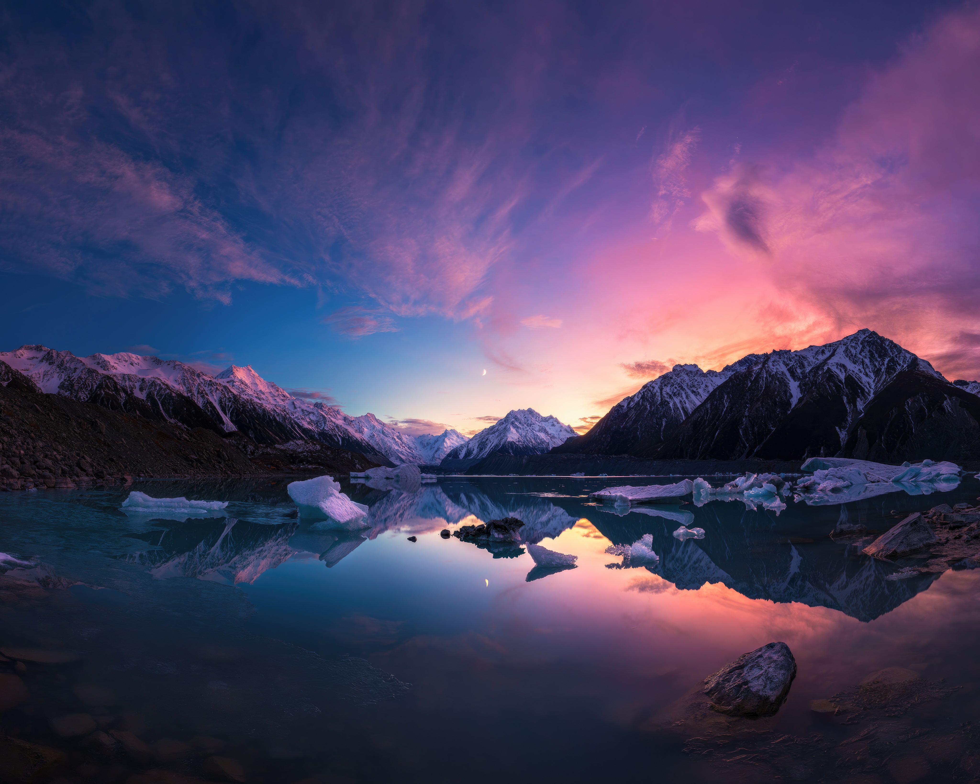 Mountains and icebergs reflected in a lake at sunset 4K HD Wallpaper