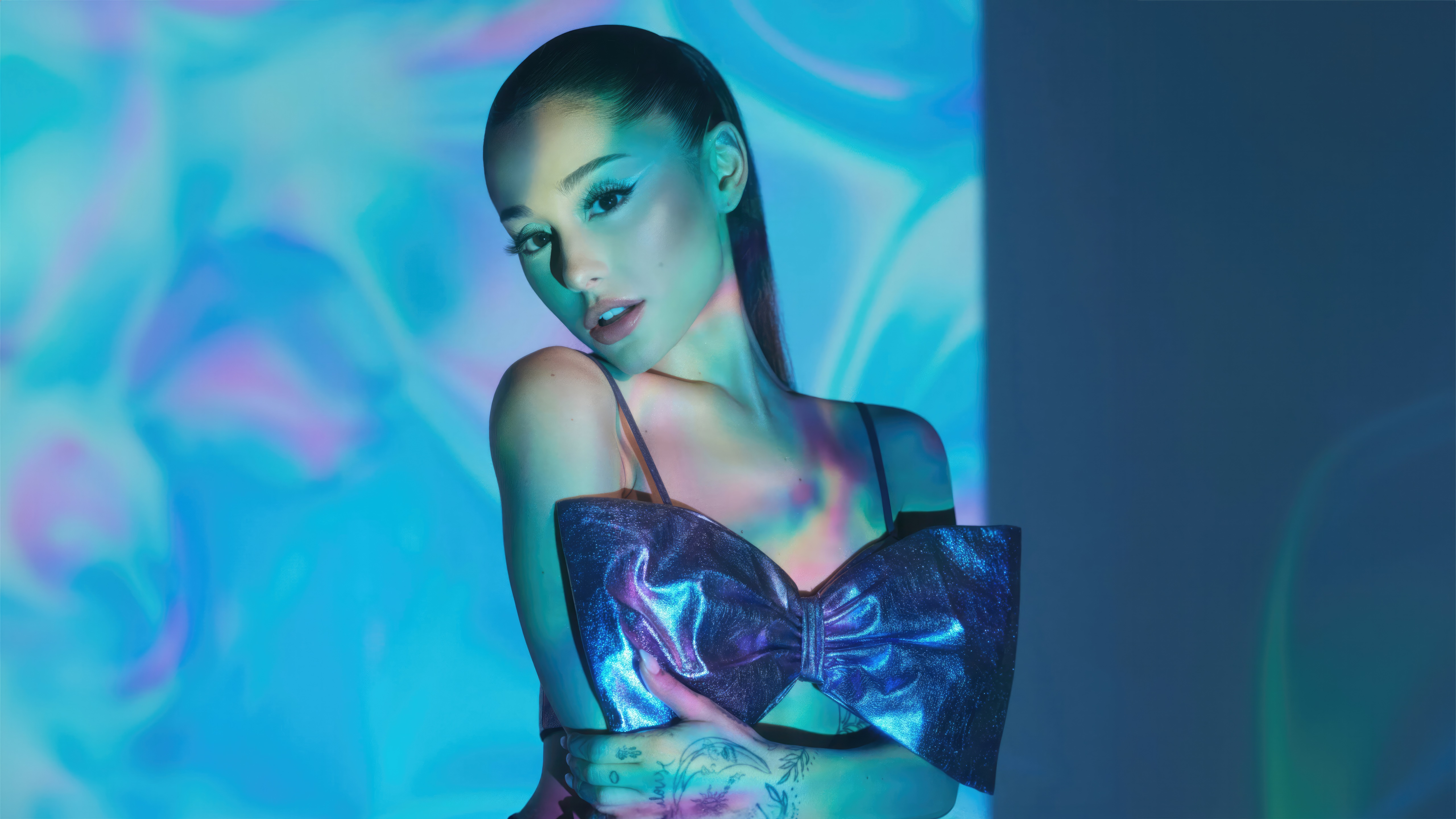 Ariana Grande in a blue and purple abstract background HD Wallpaper
