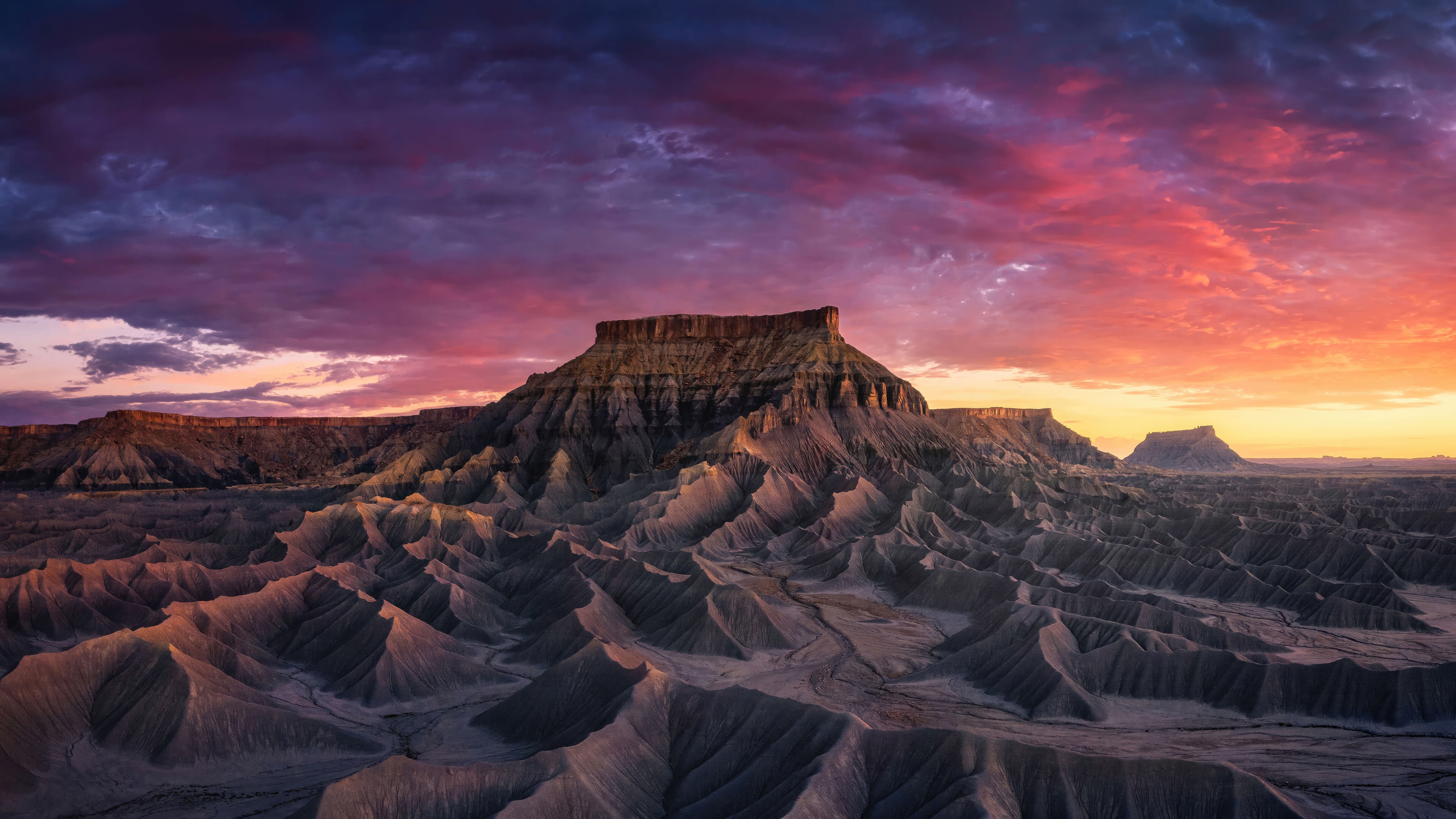 Desert landscape with mesas at sunset HD Wallpaper