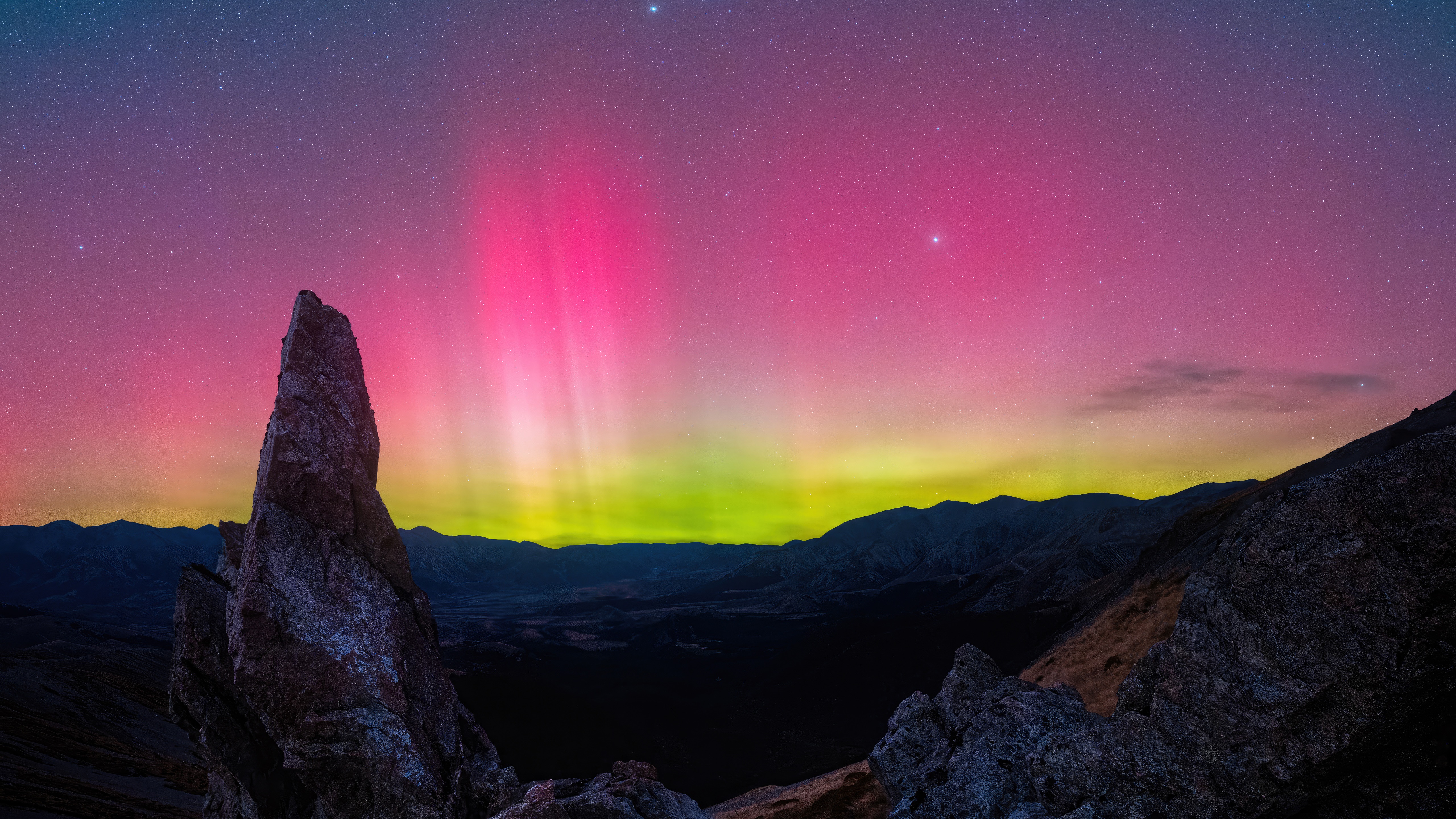 Aurora Borealis over rocky mountains at night HD Wallpaper