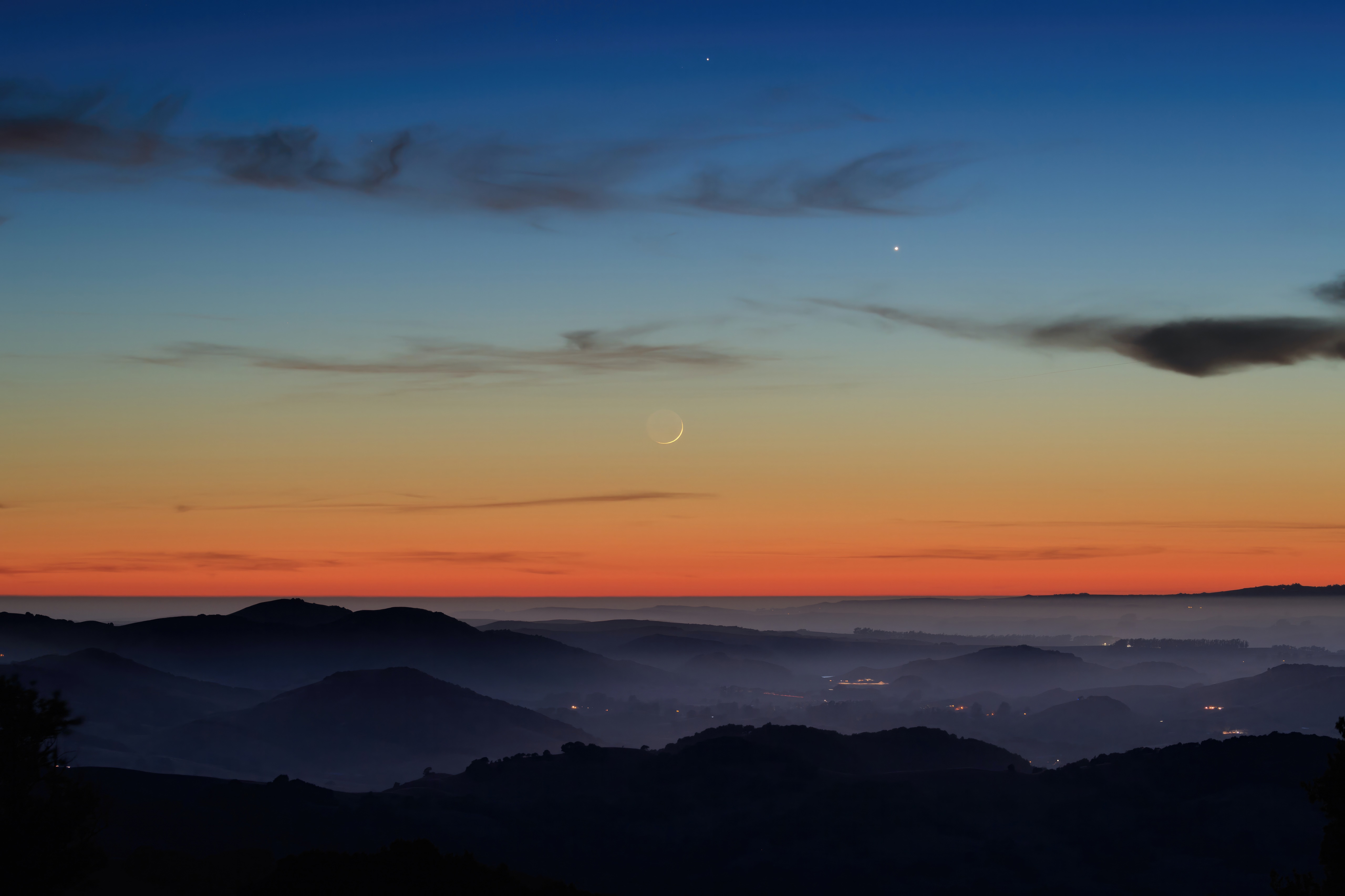 Crescent moon and planets over rolling hills at sunset HD Wallpaper