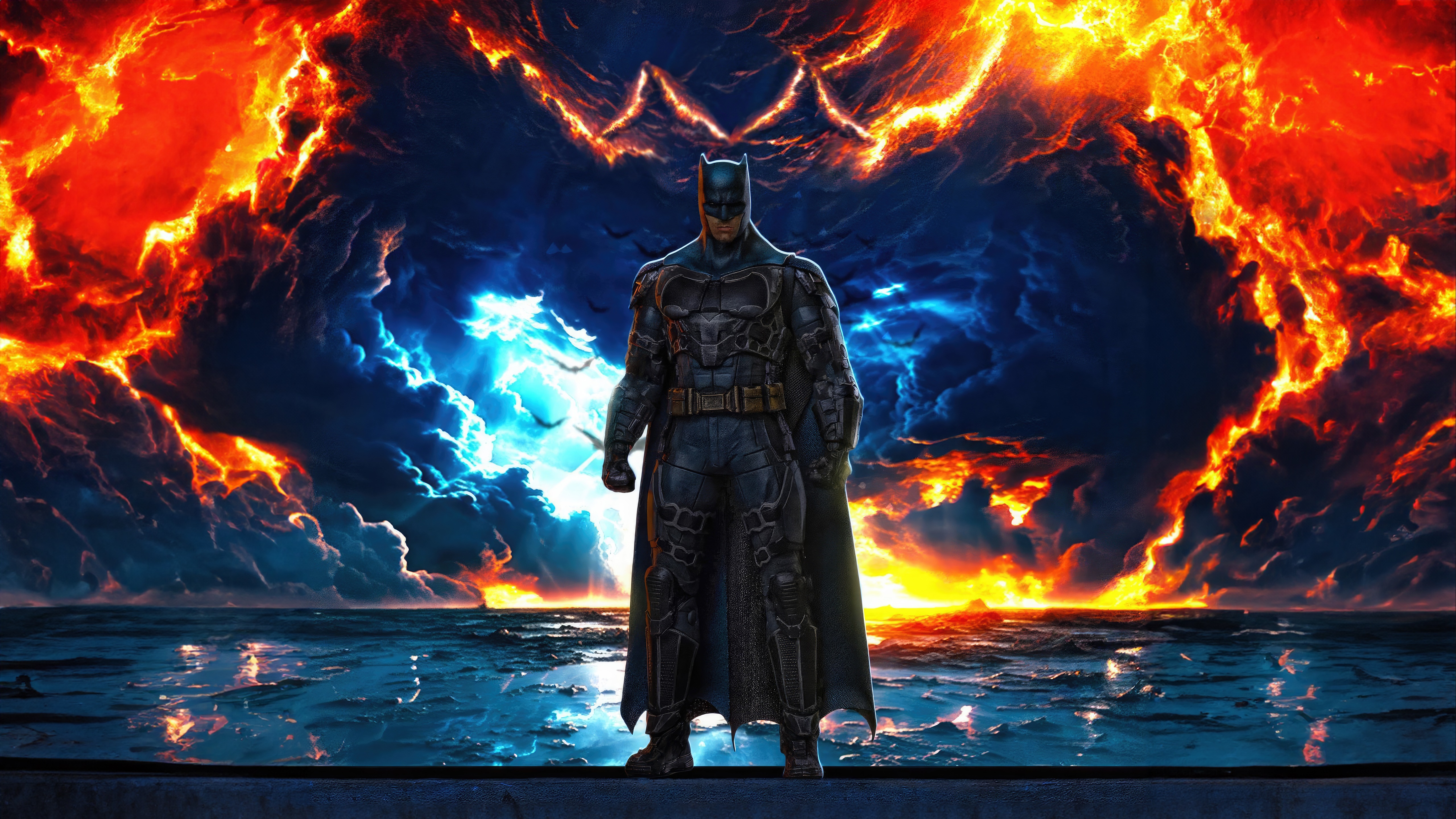 Batman standing in front of a fiery sky HD Wallpaper
