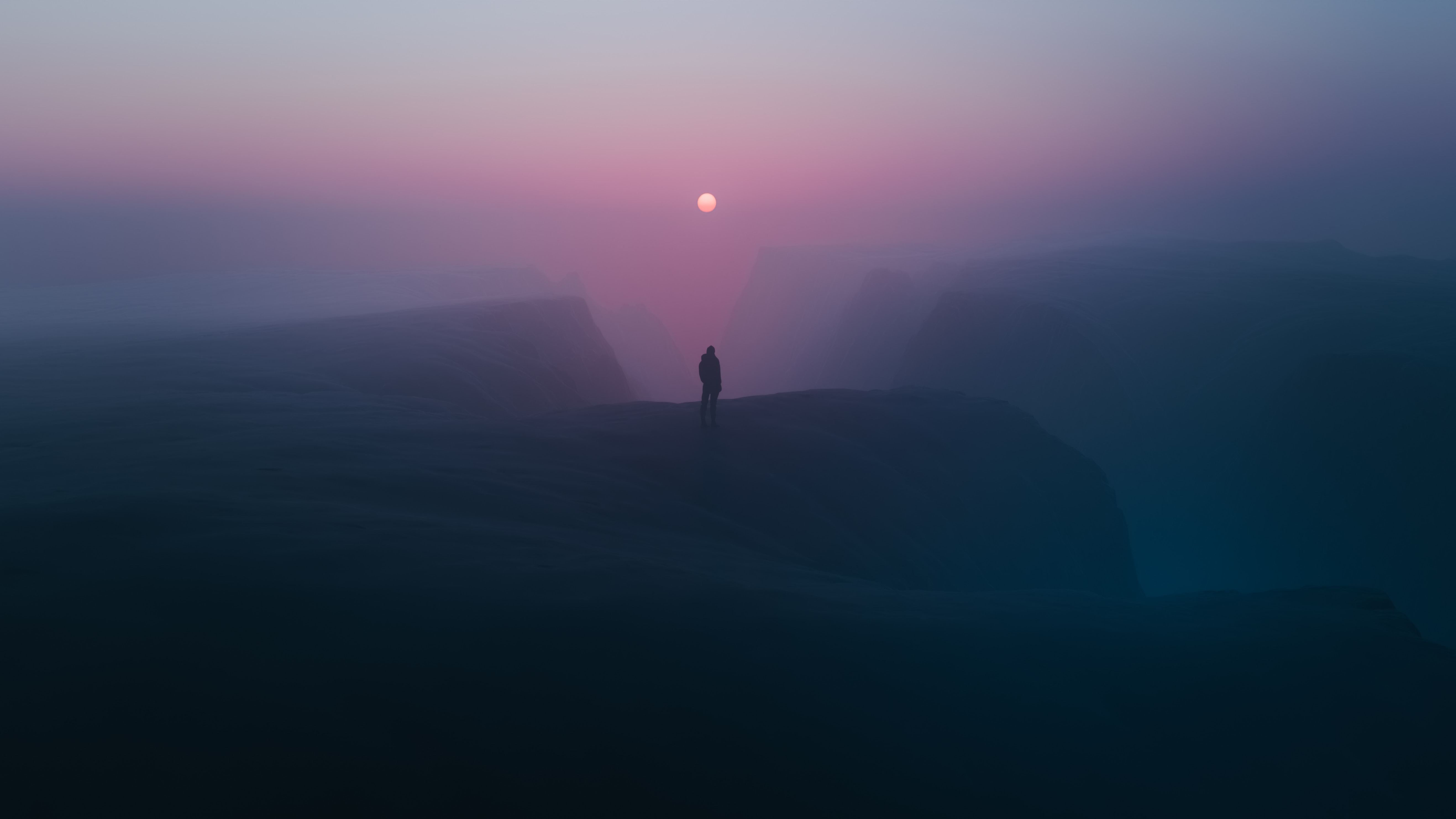 Man standing on a cliff at sunset with fog HD Wallpaper
