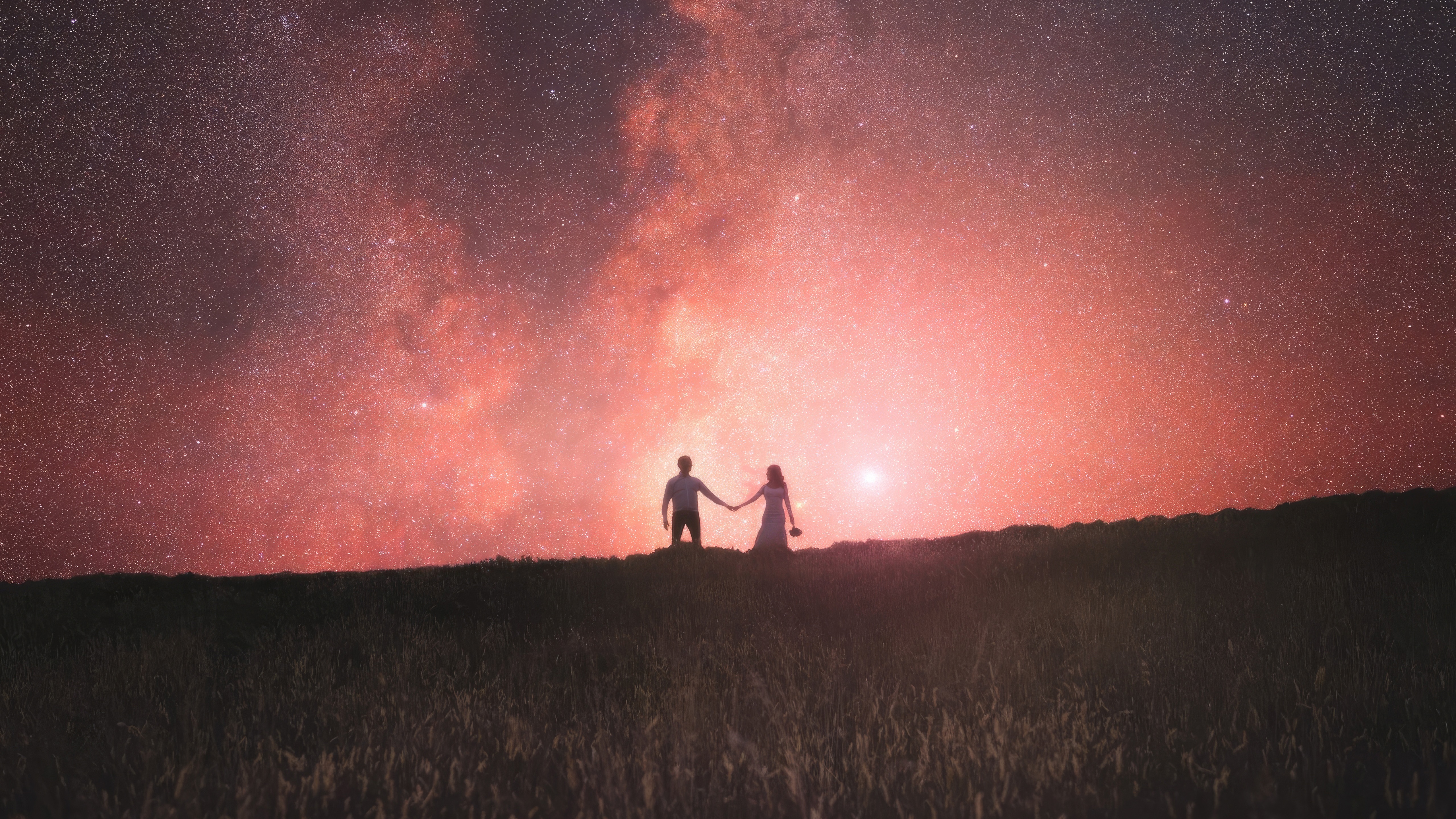 Couple holding hands under a starry sky HD Wallpaper