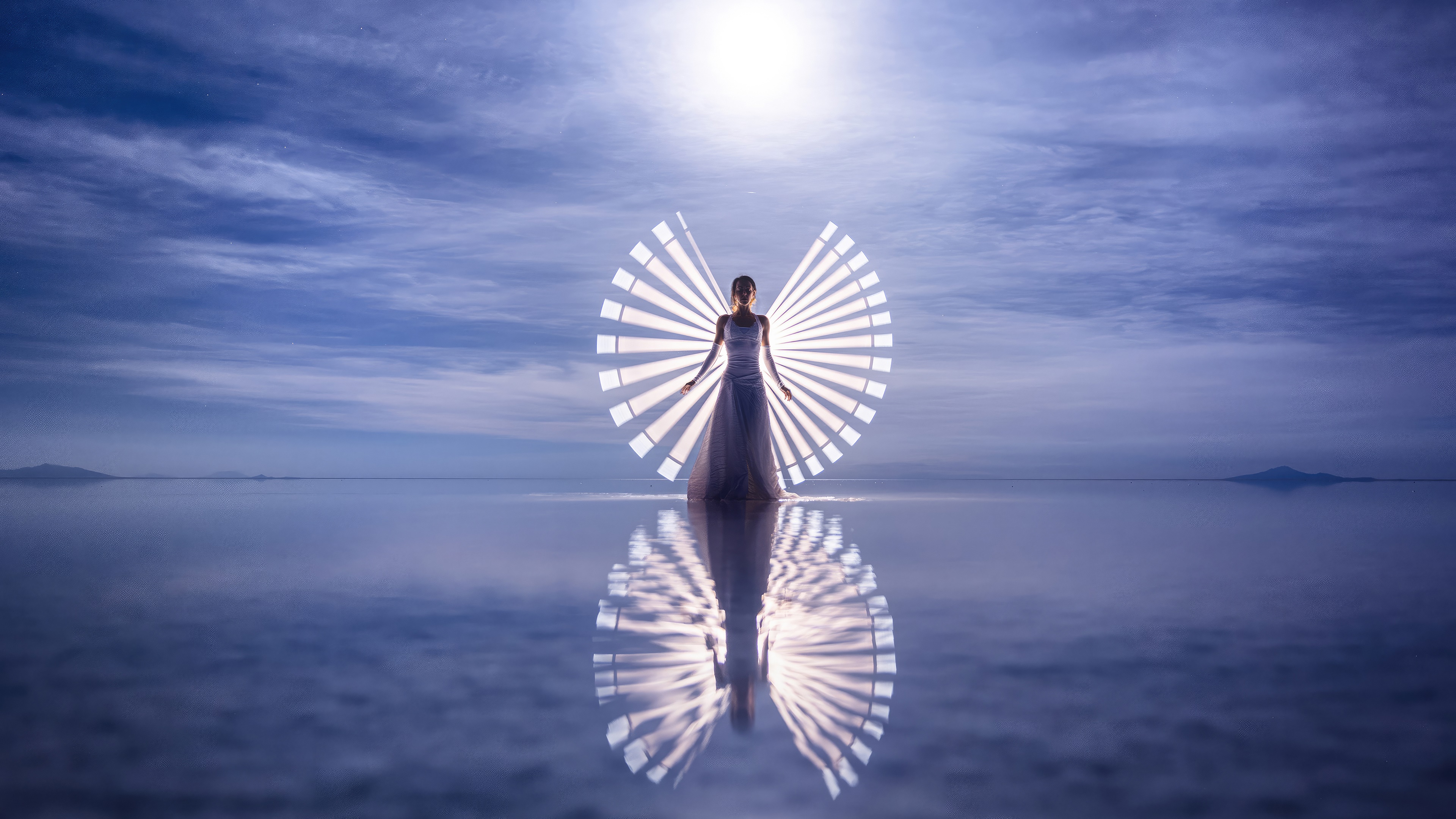 Woman with light wings reflection on water HD Wallpaper