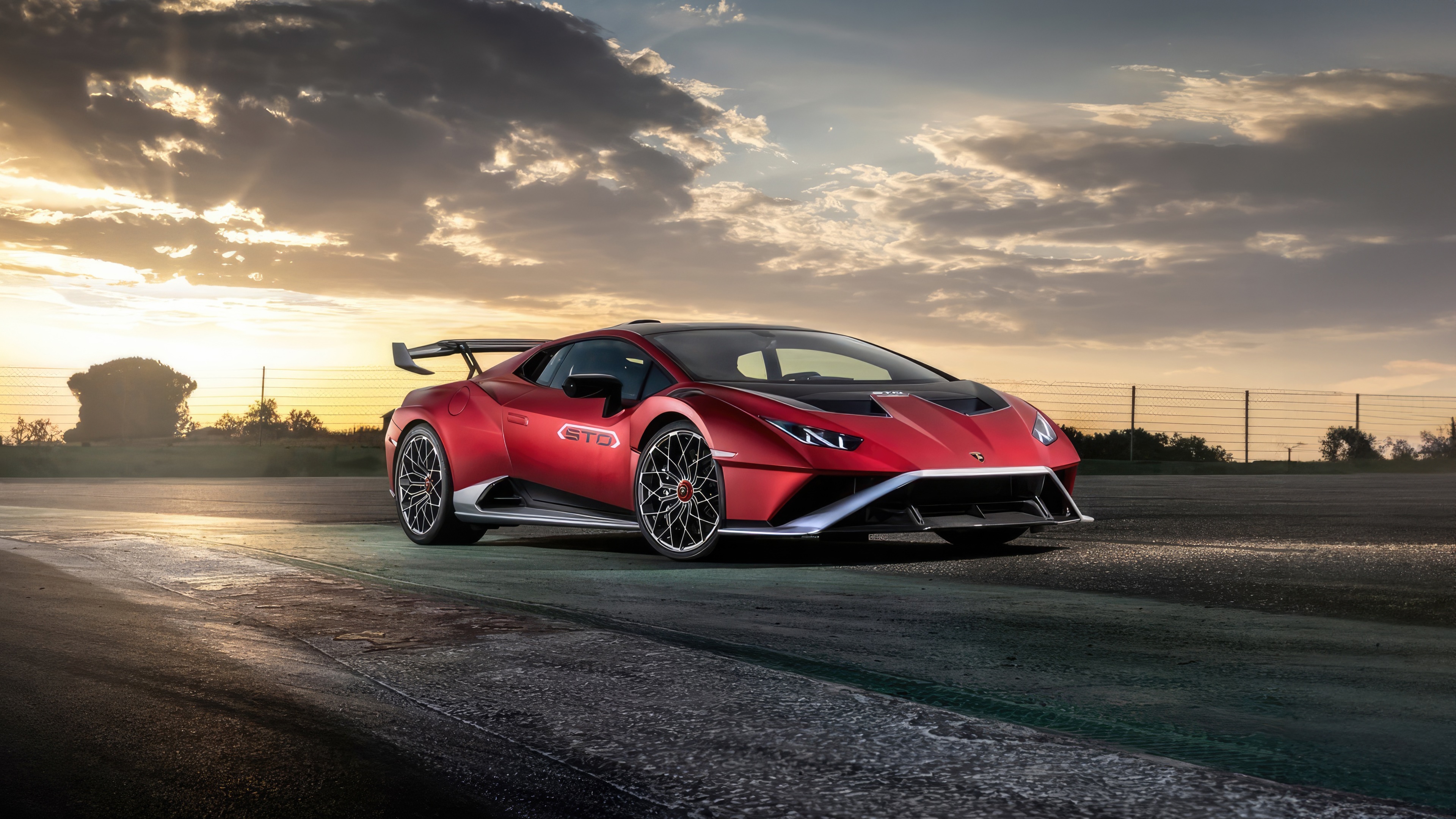 Red Lamborghini Huracan STO on a track HD Wallpaper
