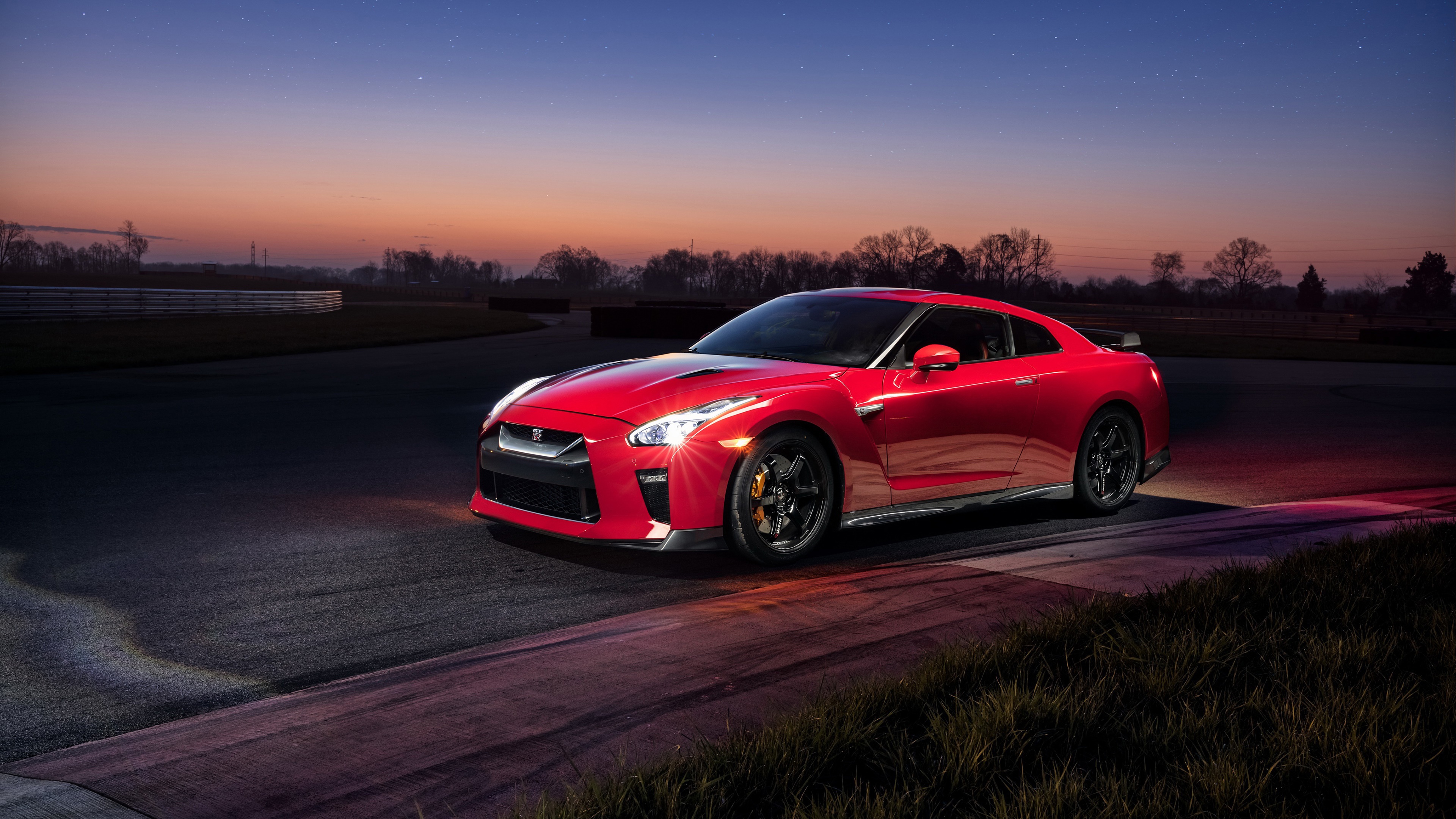 Red Nissan GT-R on a Race Track at Dusk HD Wallpaper