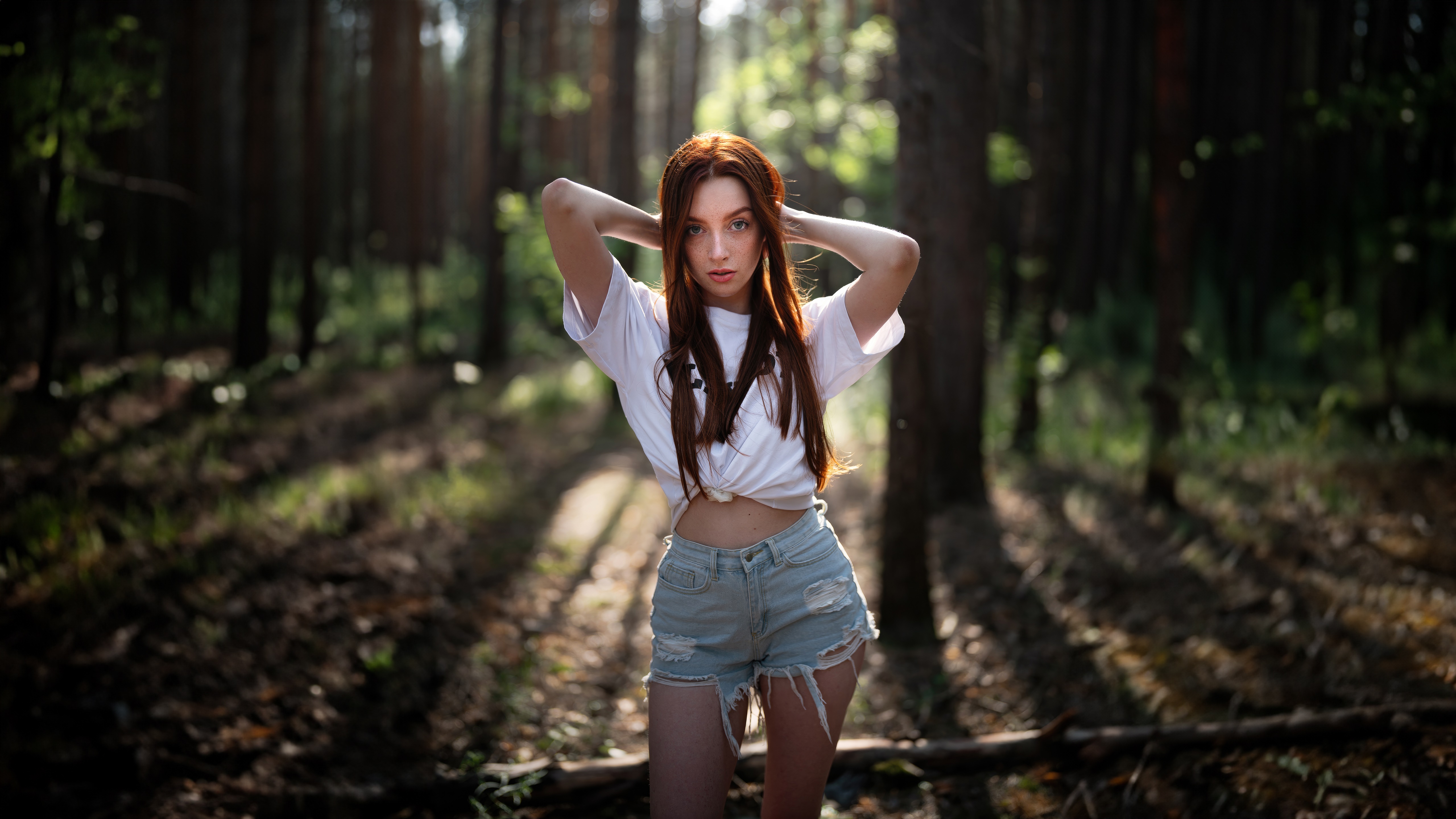 Redhead girl in denim shorts in a forest HD Wallpaper