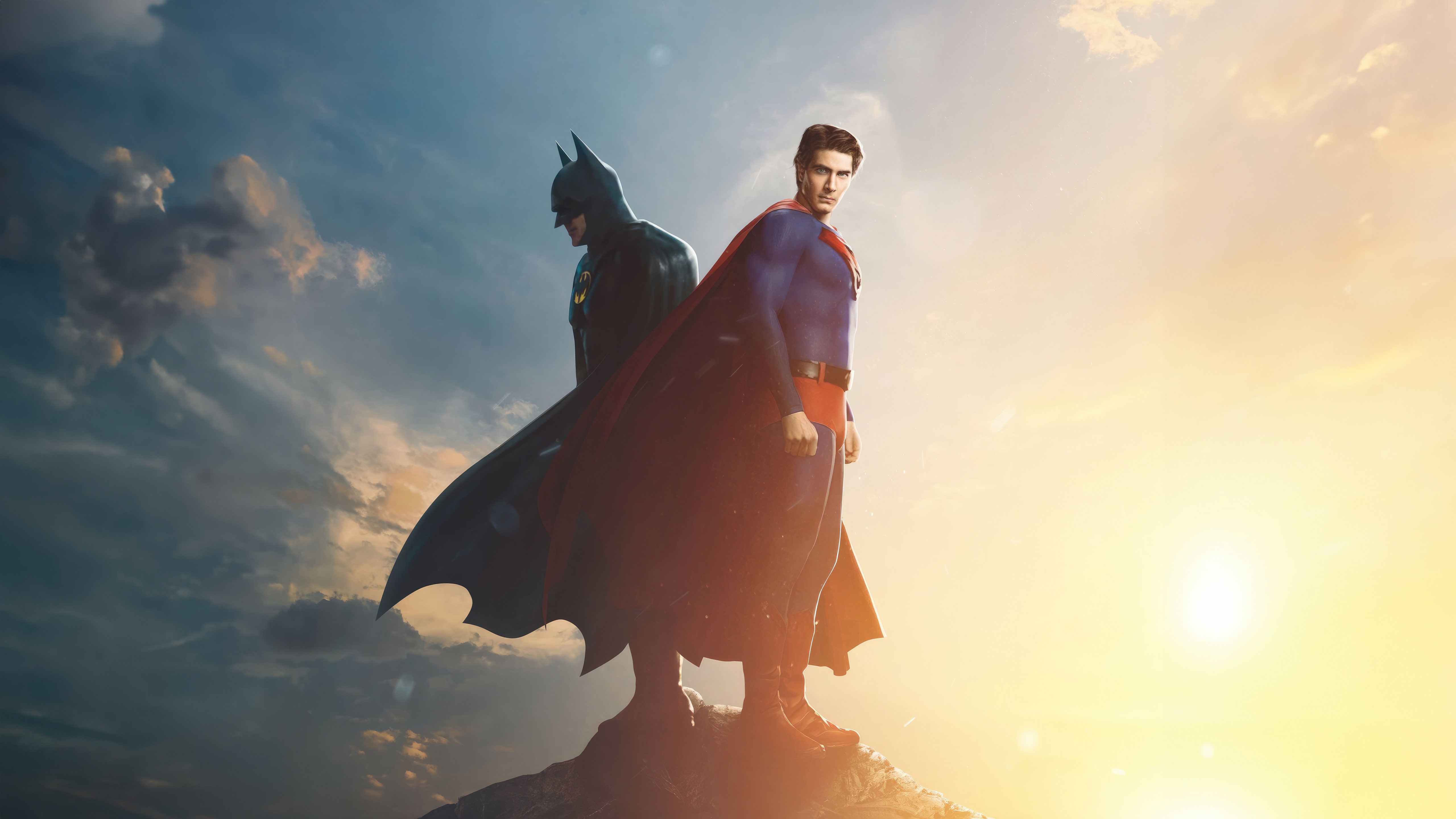 Batman and Superman standing on a rock HD Wallpaper