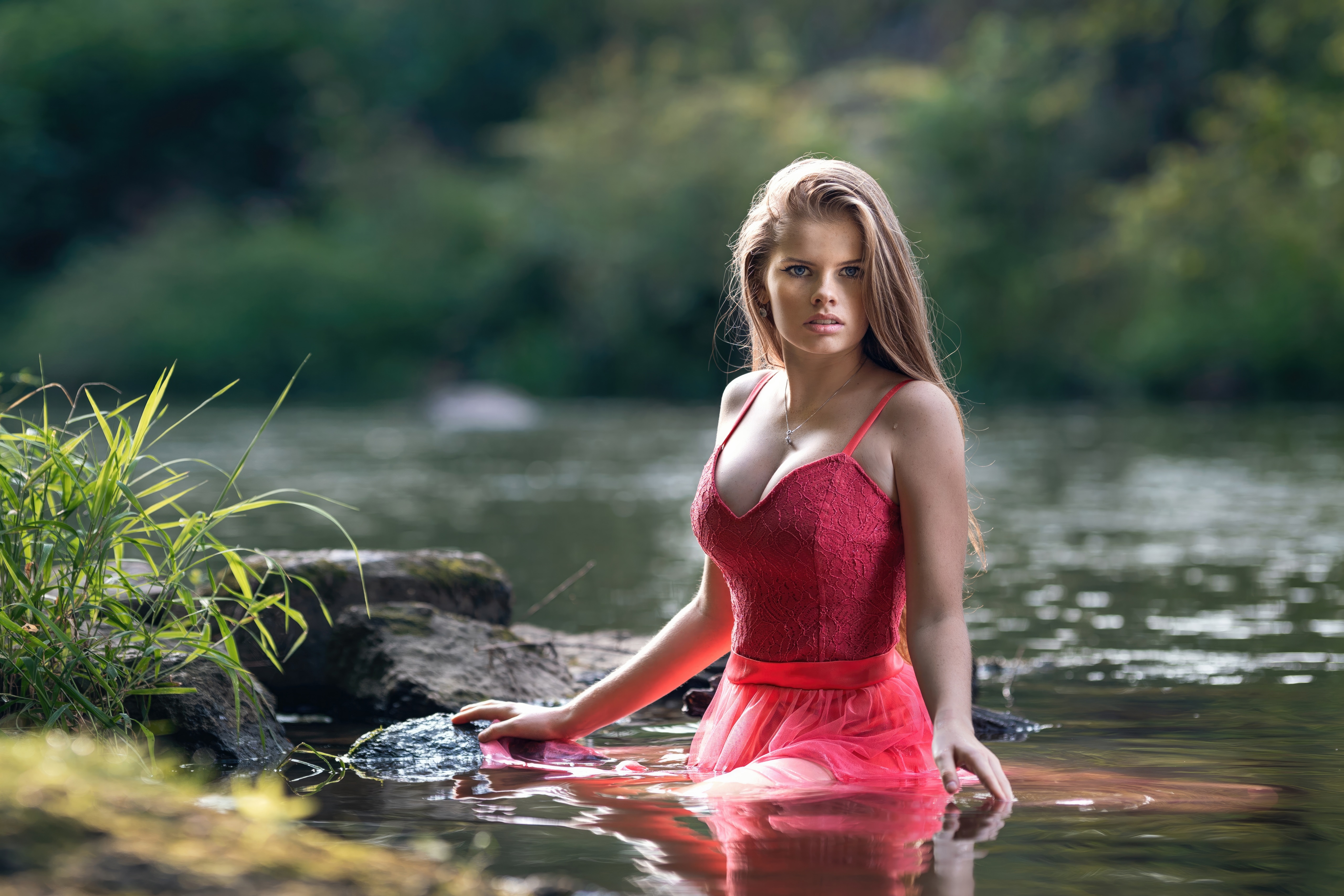 Model in red dress in water HD Wallpaper