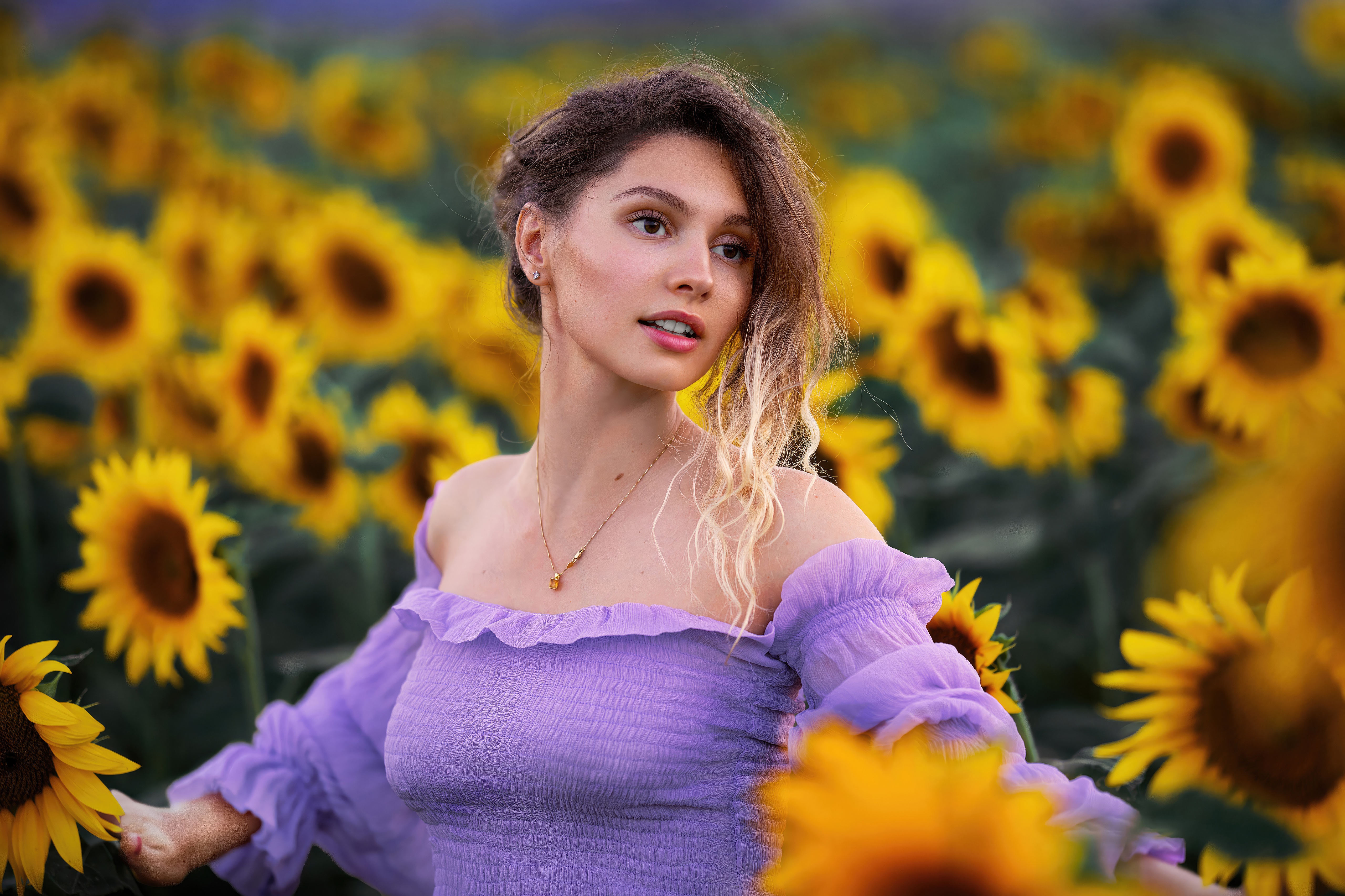 Model in a sunflower field HD Wallpaper
