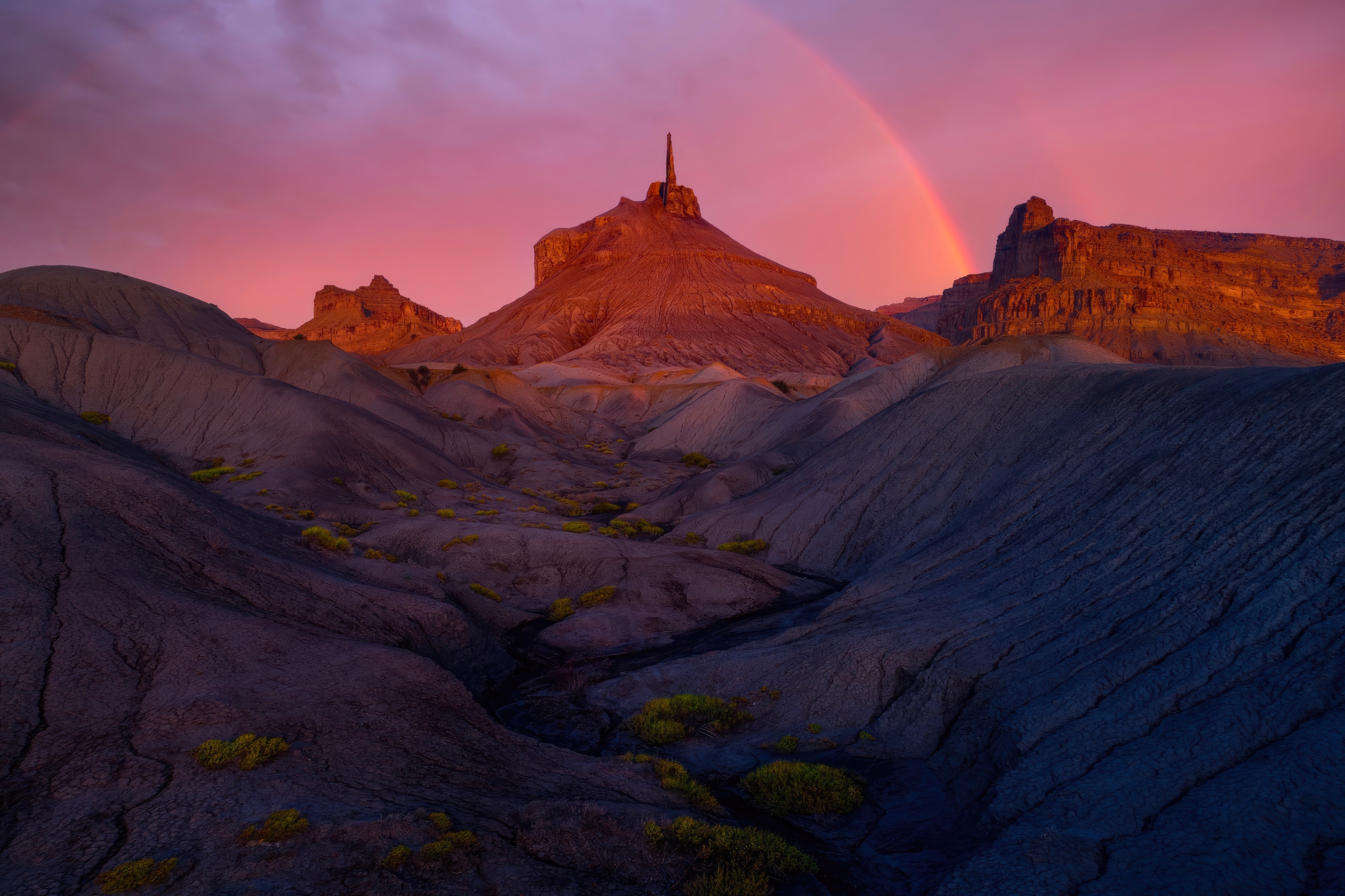 Desert landscape with rainbow and rock formations at sunset HD Wallpaper