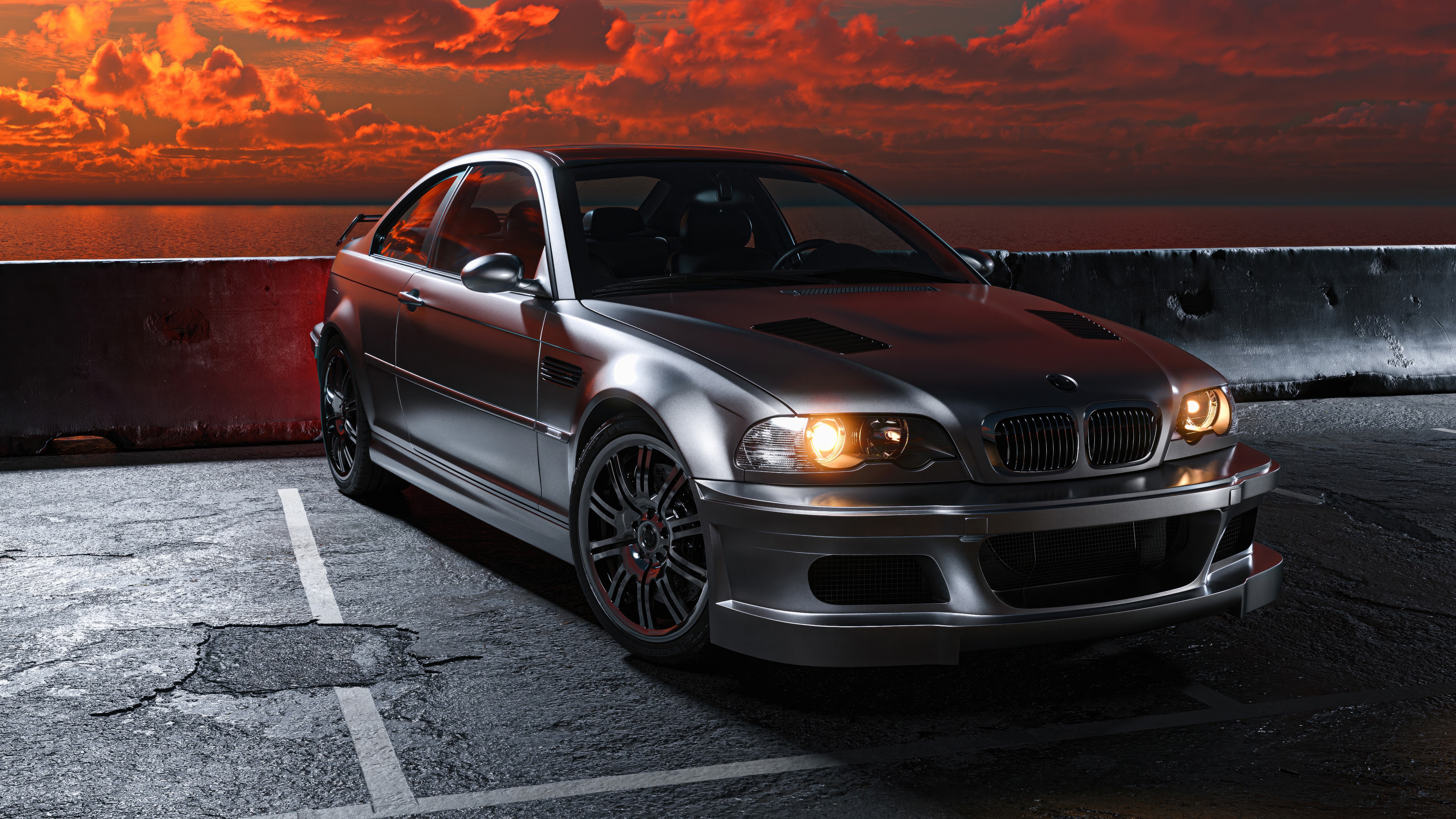 Silver BMW M3 parked by the ocean at sunset HD Wallpaper