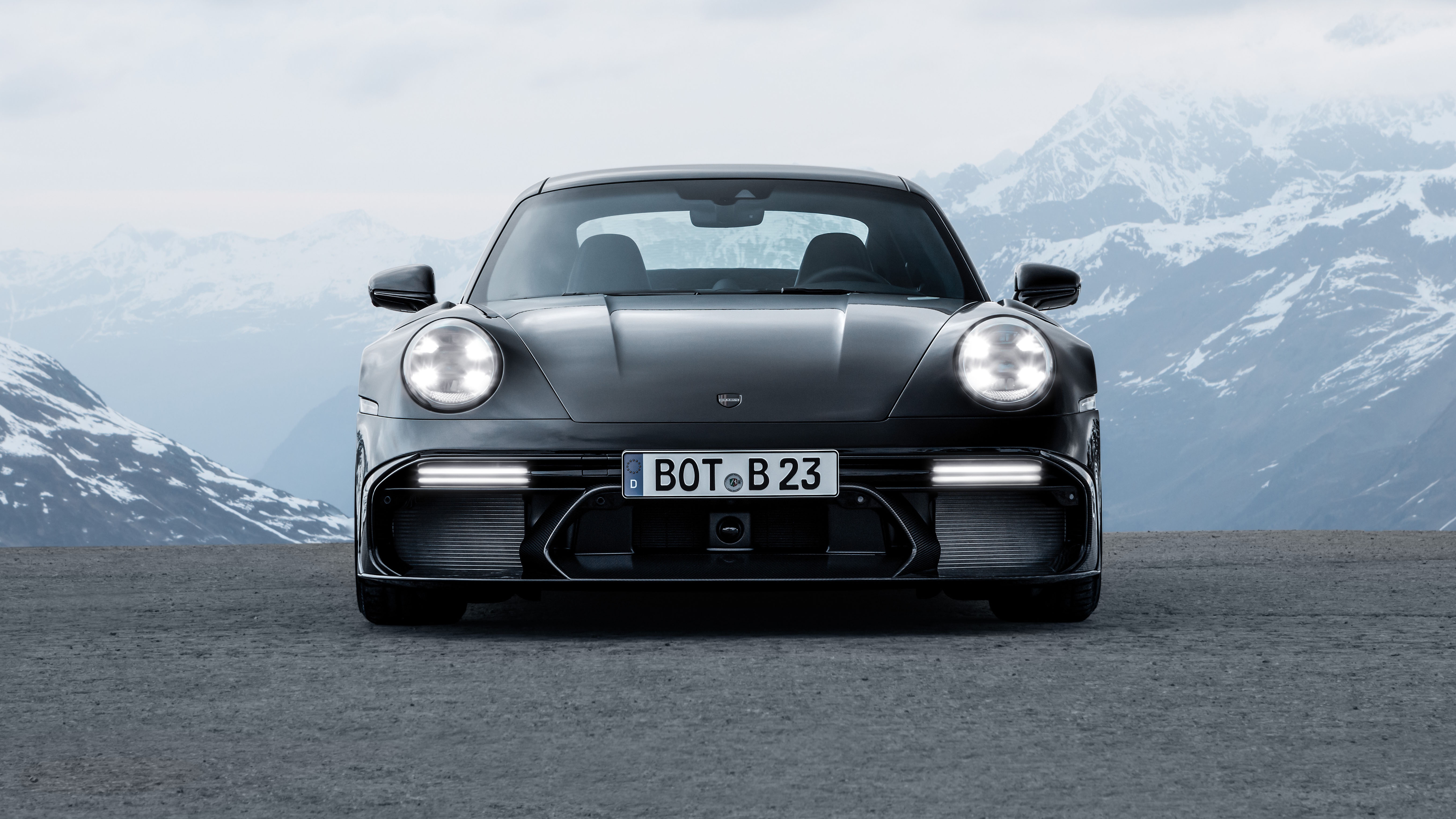 Porsche 911 in front of snowy mountains HD Wallpaper