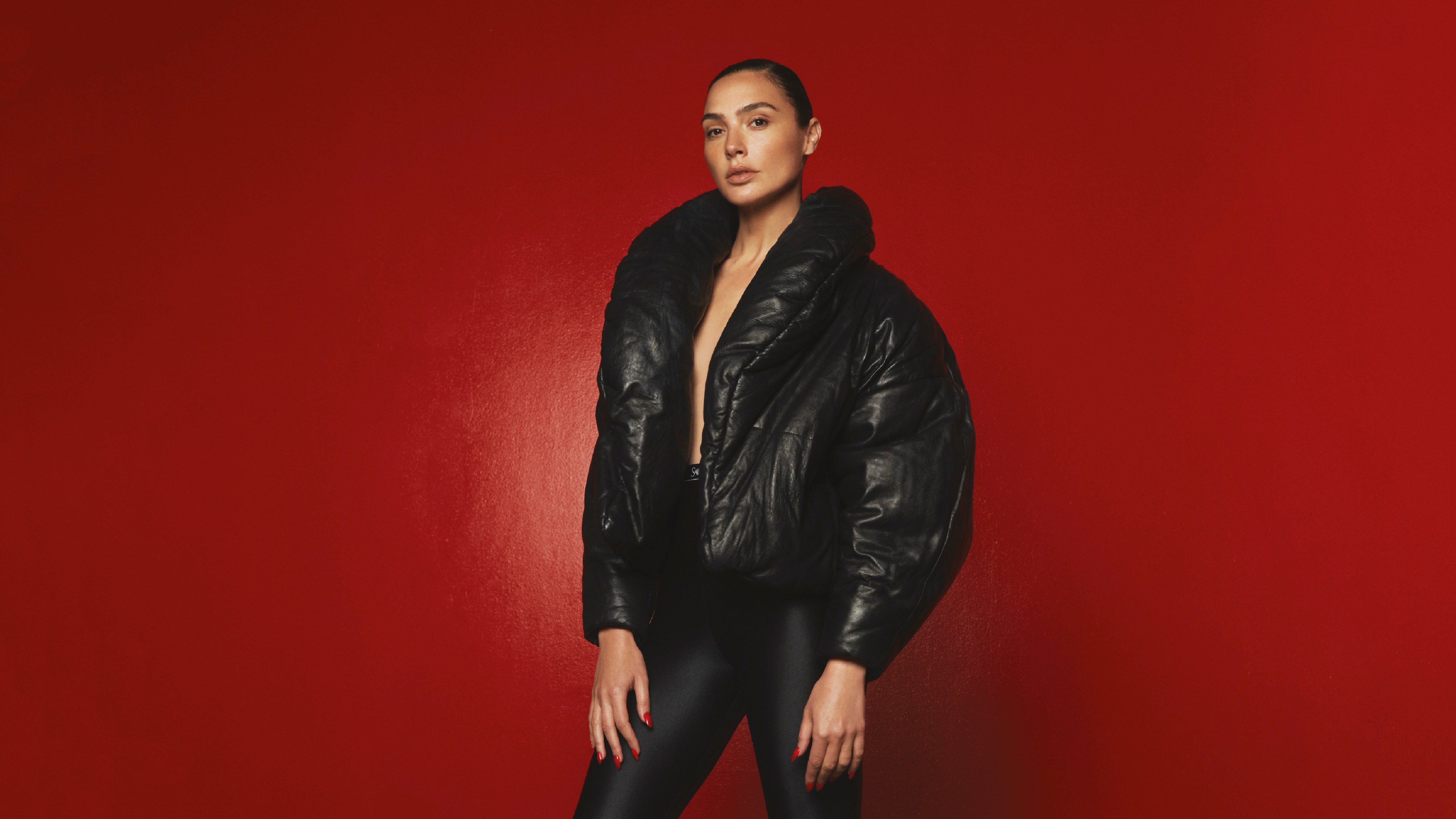 Gal Gadot in a black puffer jacket HD Wallpaper