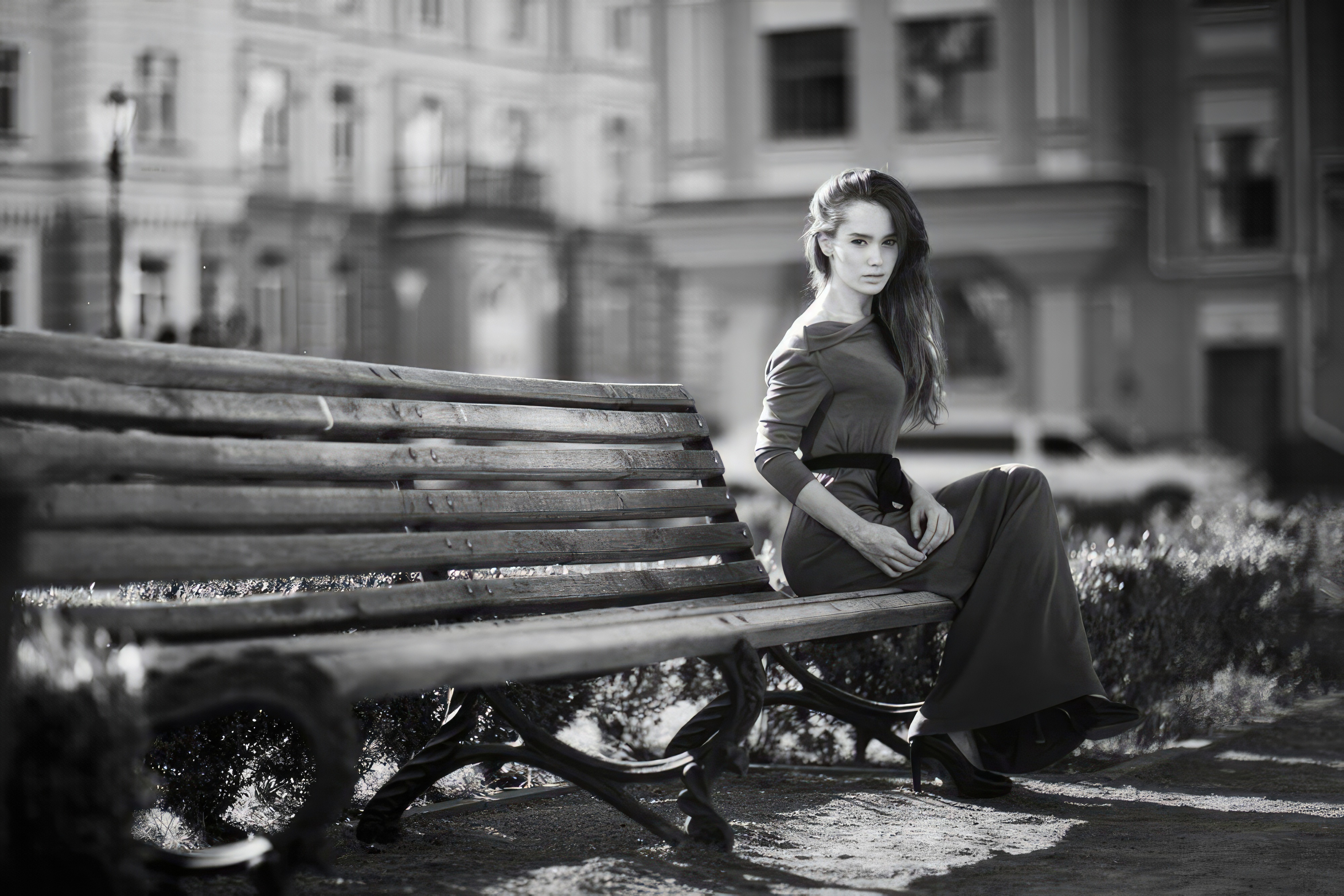 Monochrome portrait of a model in a dress on a bench HD Wallpaper