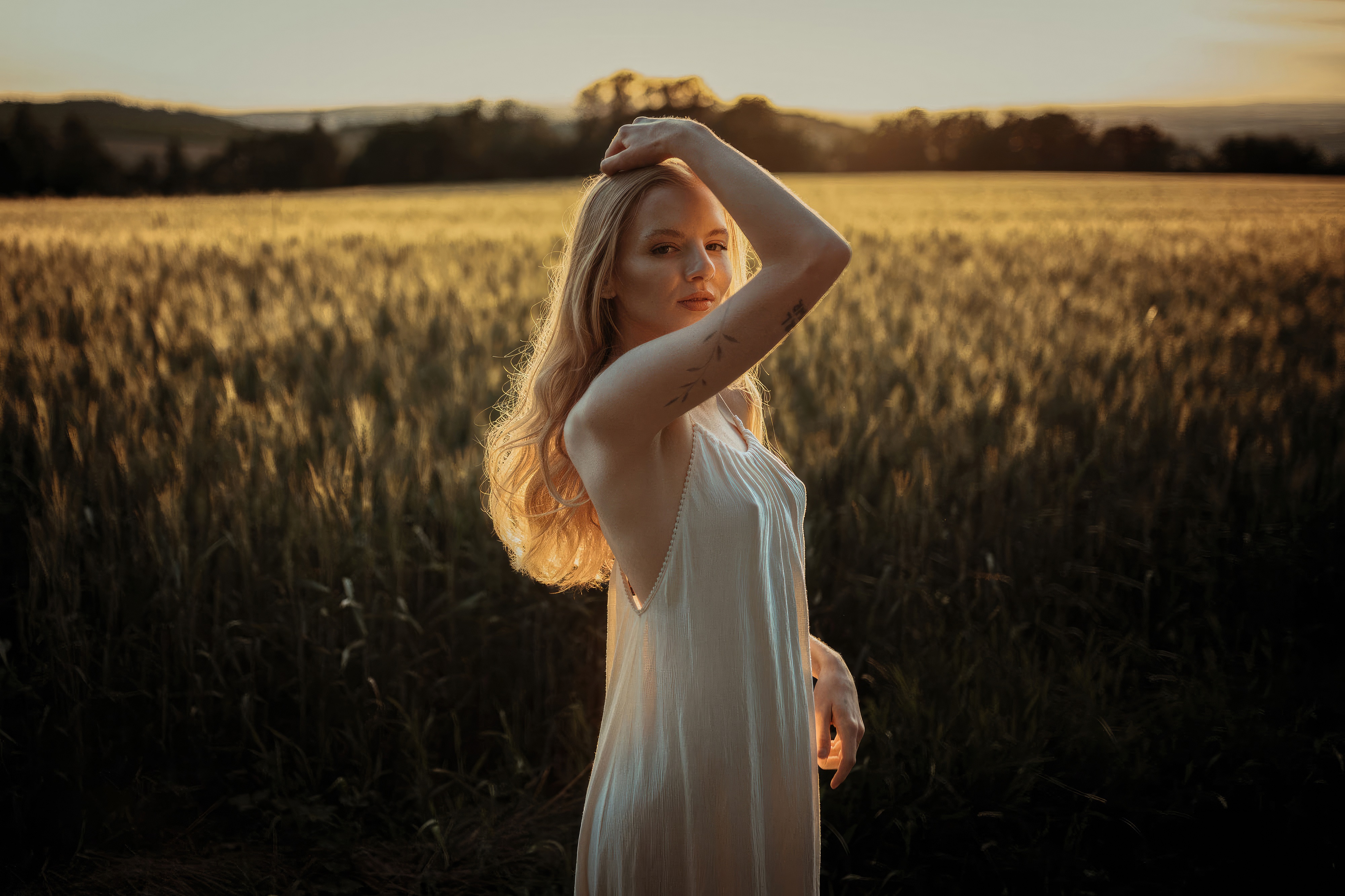Girl in white dress in a wheat field at sunset HD Wallpaper
