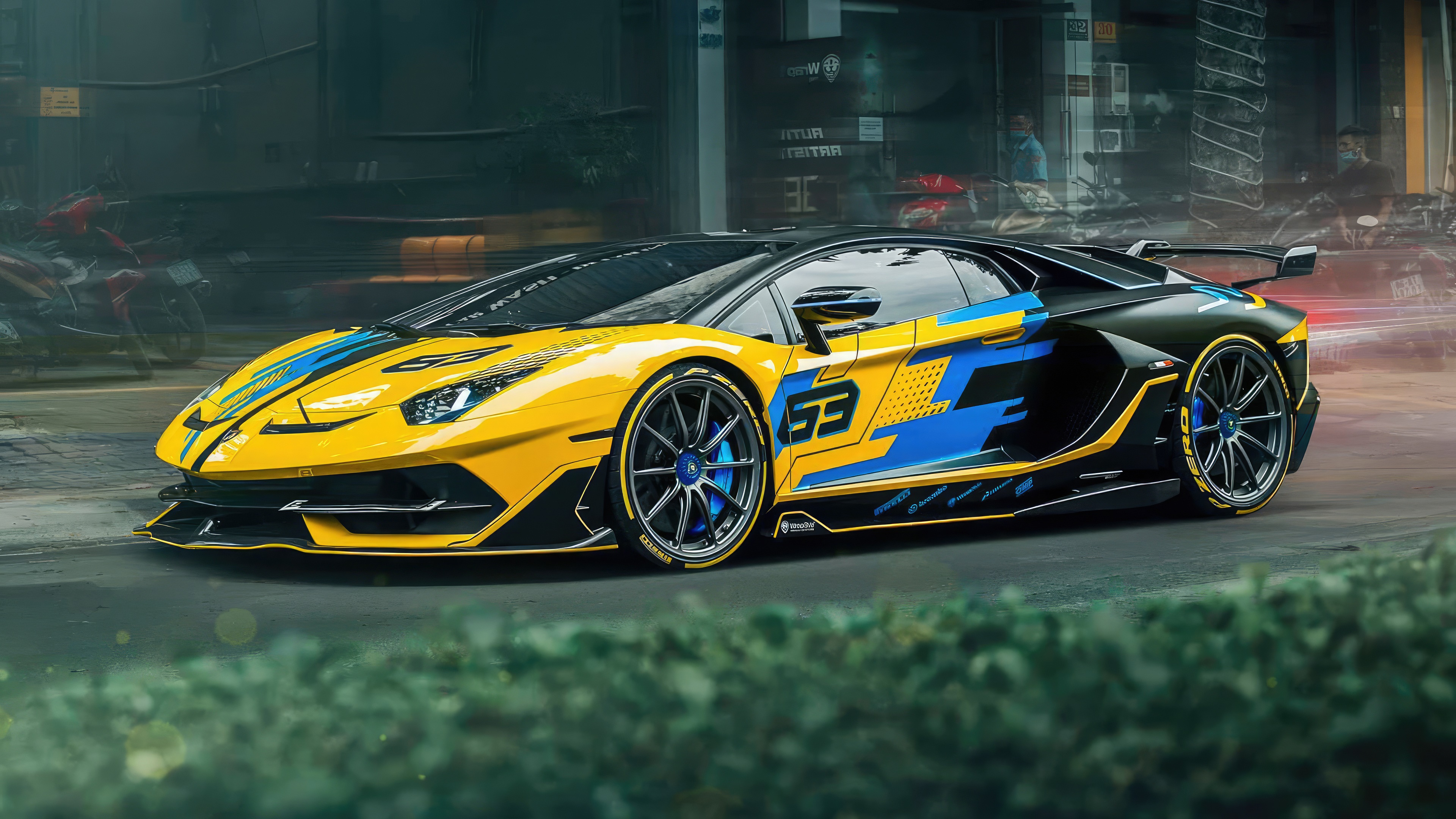 Yellow and black Lamborghini Aventador SVJ with blue accents HD Wallpaper