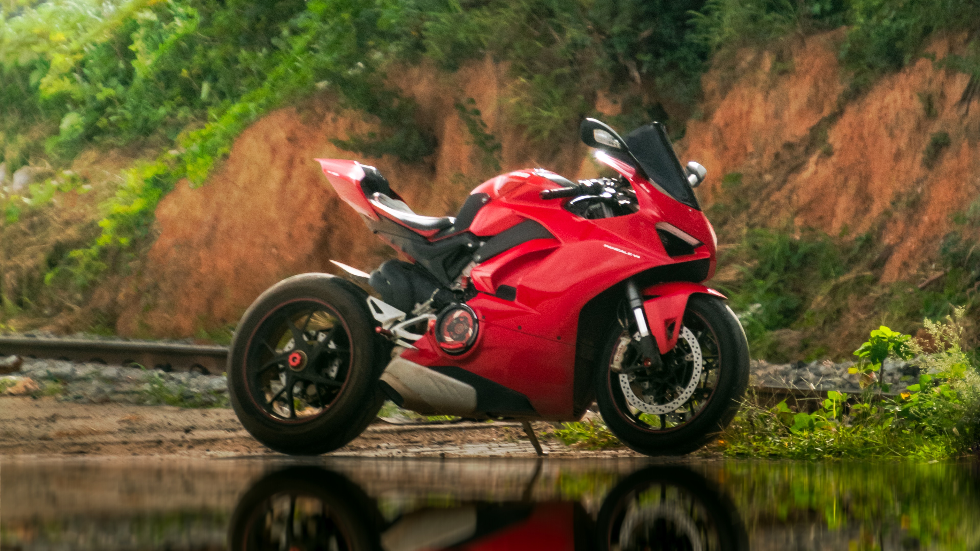 Red Ducati Motorcycle on Tracks HD Wallpaper