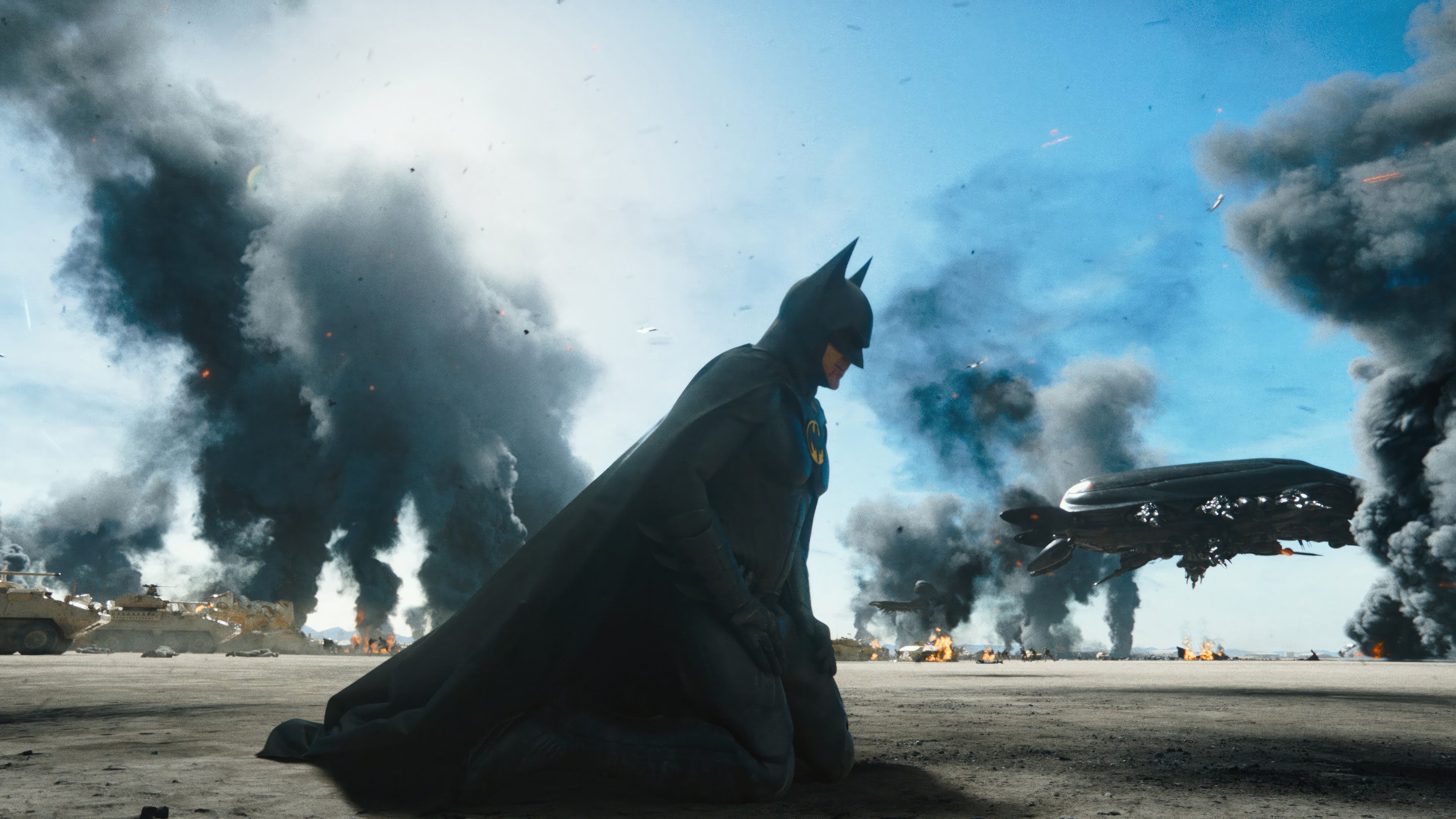 Batman in a post-apocalyptic battle scene HD Wallpaper