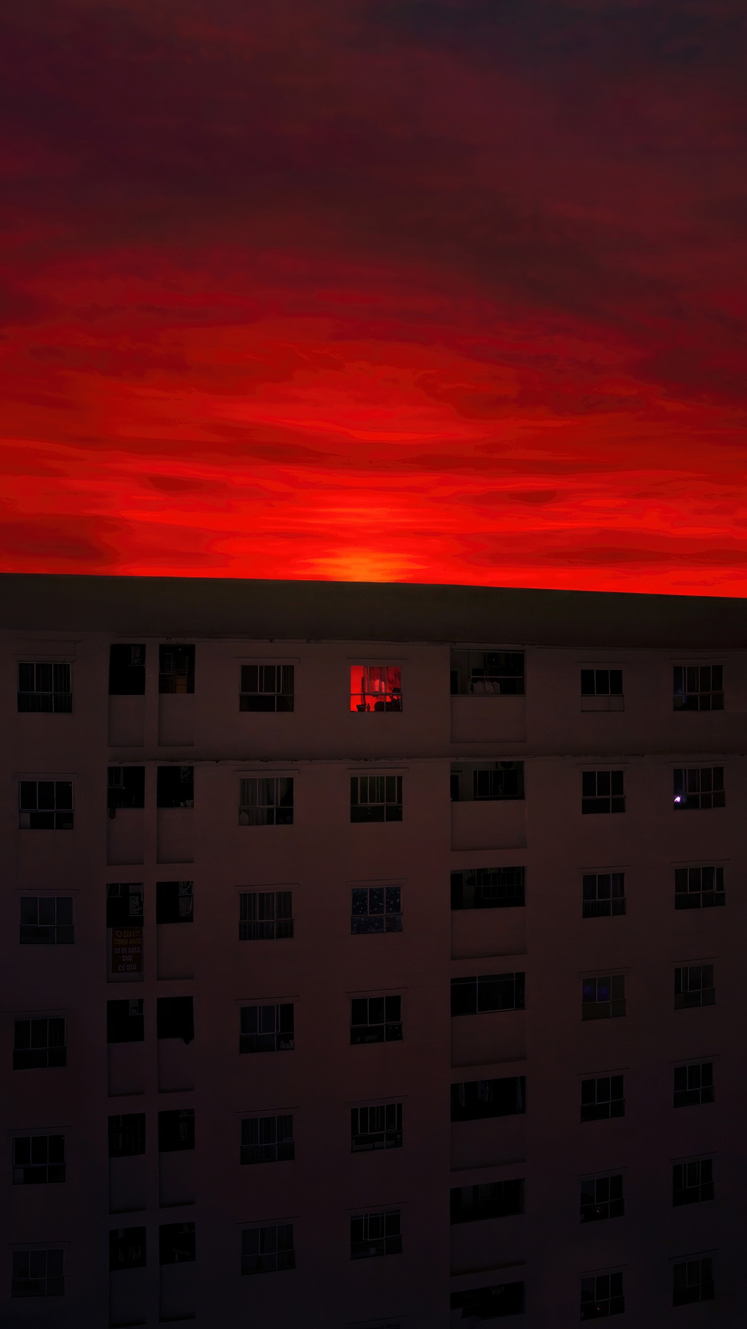 Red sky over apartment building at dusk HD Phone Wallpaper