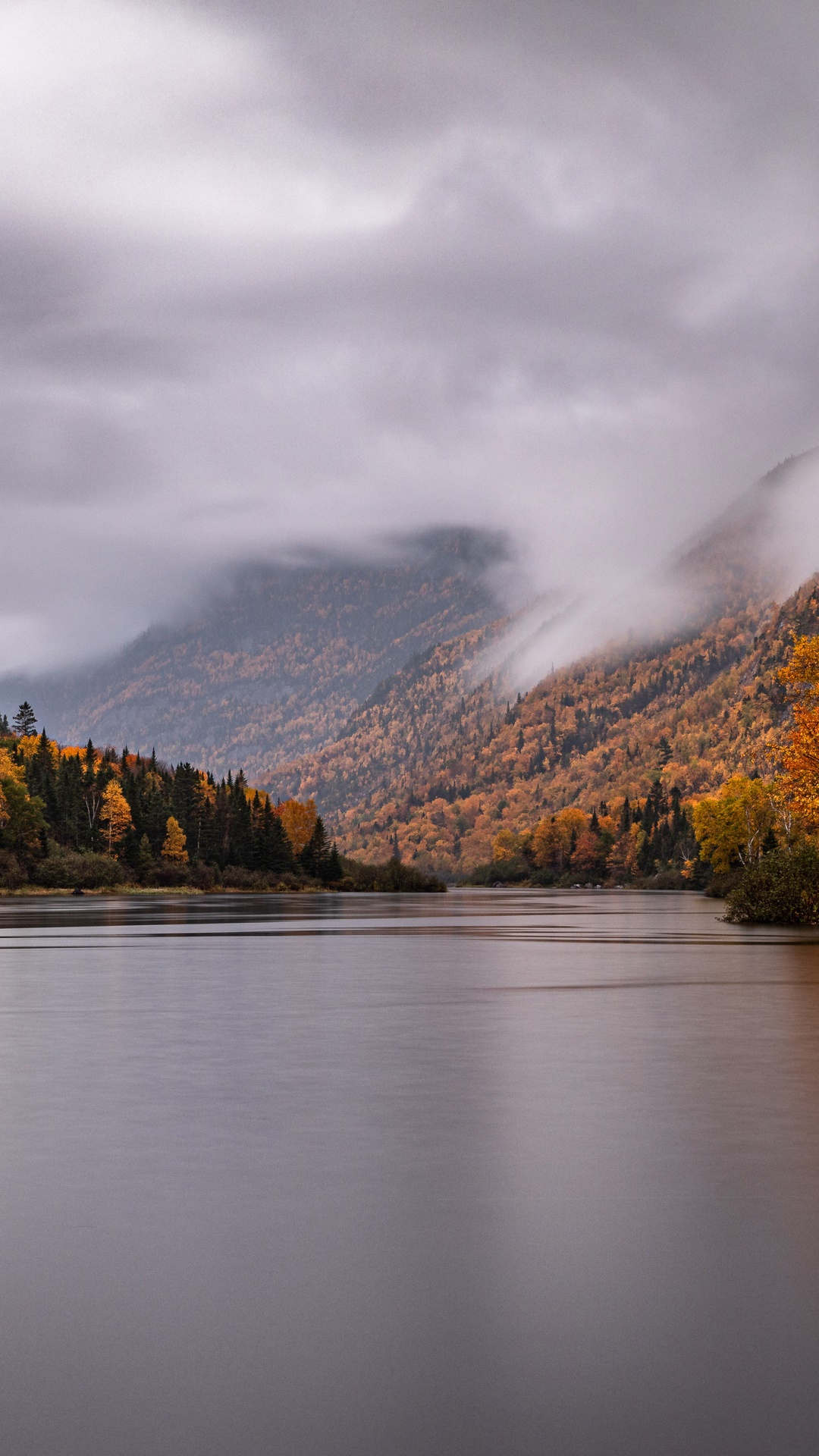 Autumn forest and mountains reflected in a lake HD Phone Wallpaper