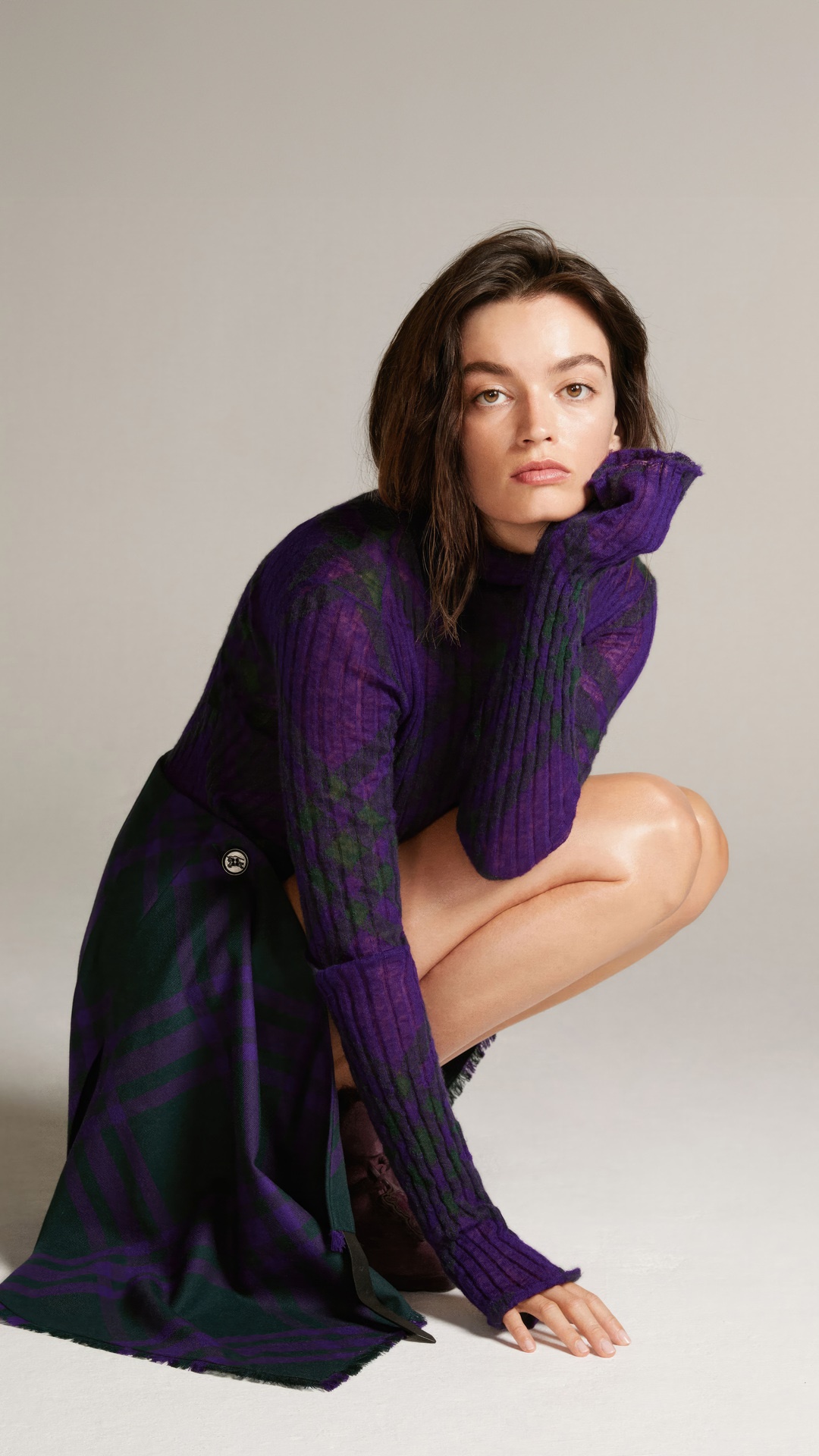 Emma Mackey in purple and green plaid outfit HD Phone Wallpaper