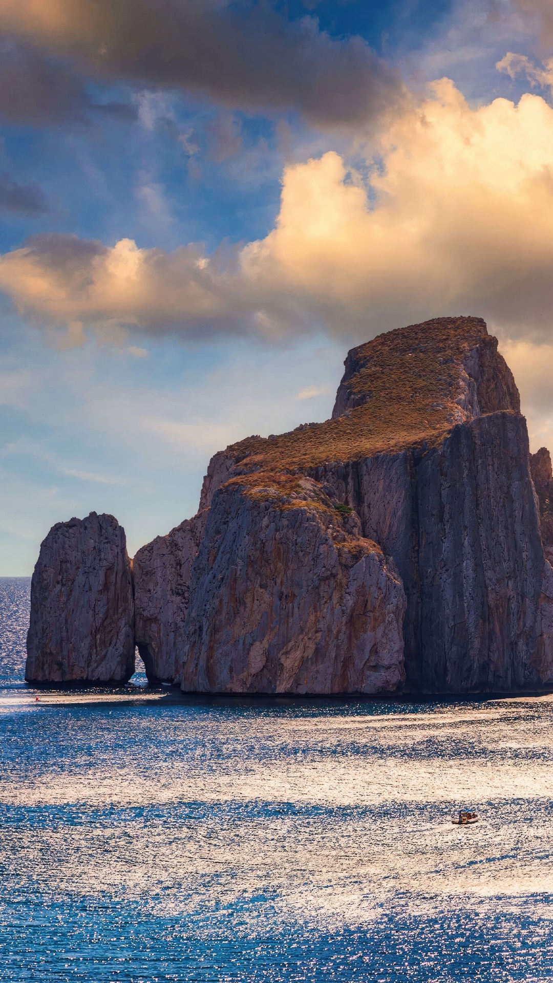Rocky islands in the sea under a cloudy sky HD Phone Wallpaper