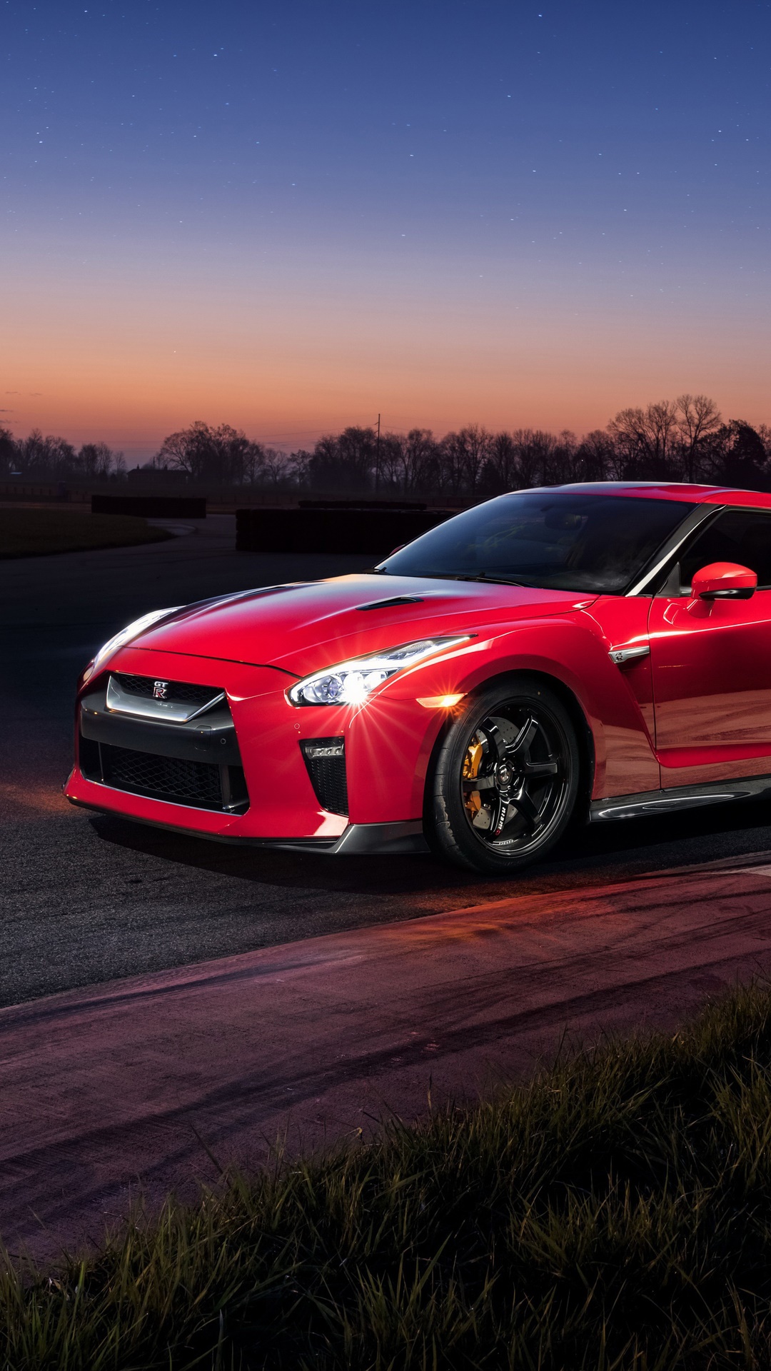 Red Nissan GT-R on a Racetrack at Dusk HD Phone Wallpaper