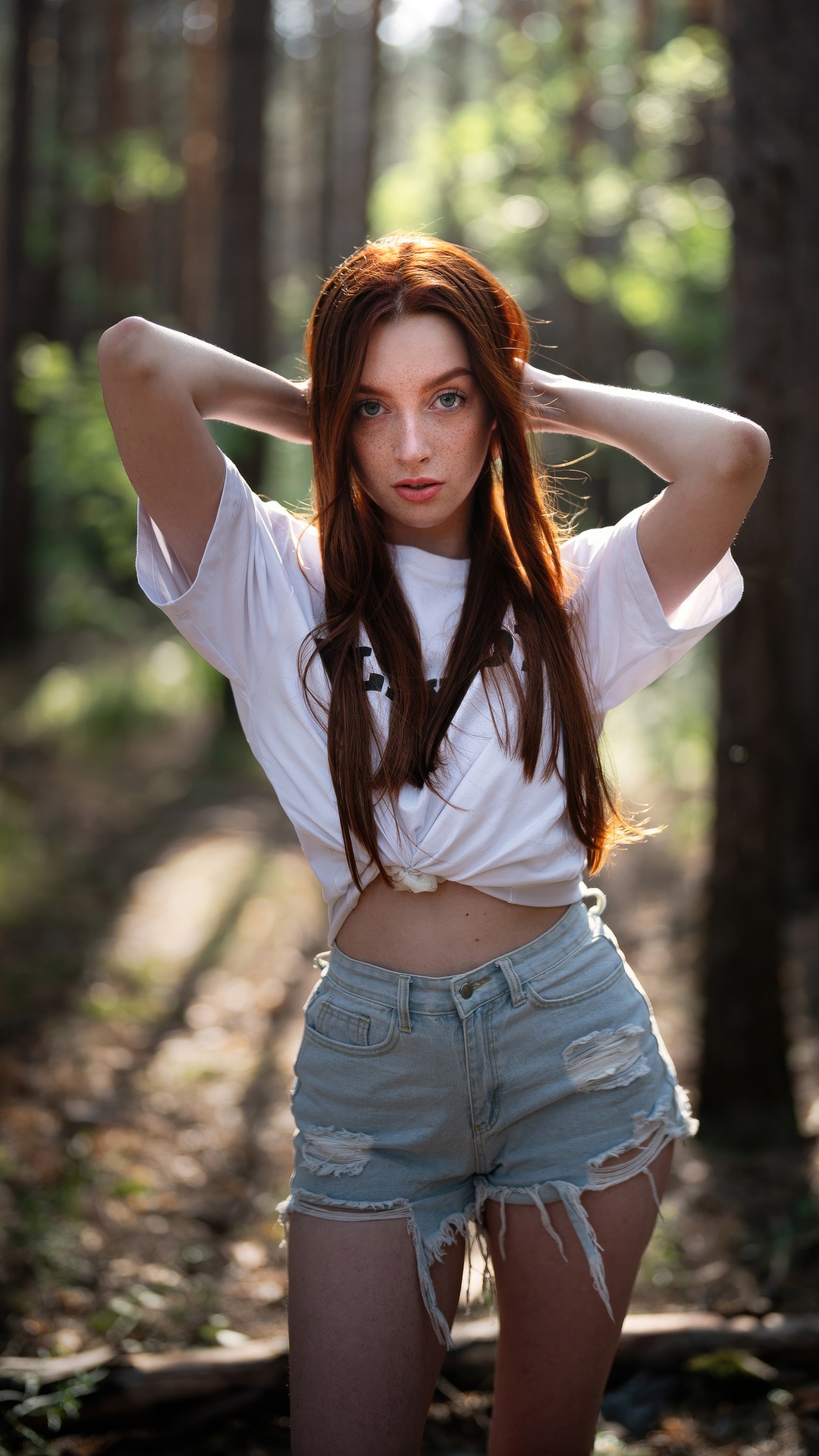Redhead model in ripped denim shorts and white t-shirt HD Phone Wallpaper
