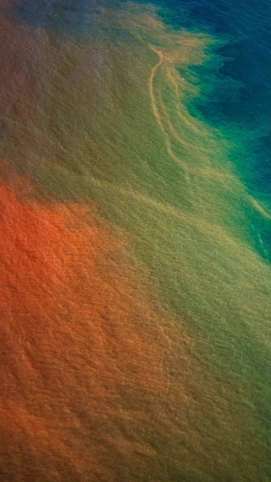 Aerial view of ocean currents with sediment HD Phone Wallpaper