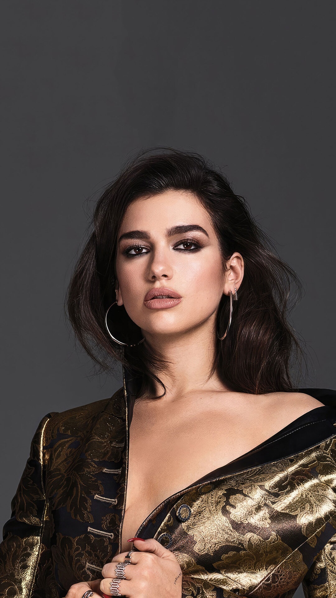 Dua Lipa in a gold and black jacket HD Phone Wallpaper