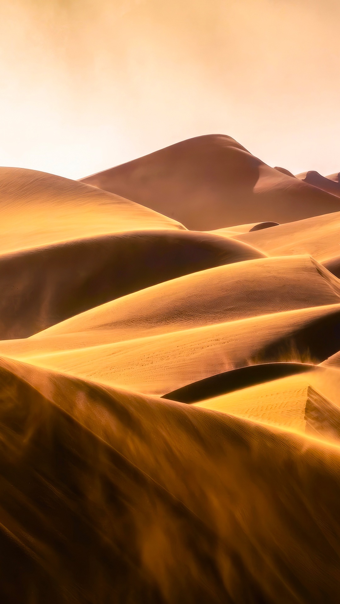 Golden sand dunes under a hazy sky HD Phone Wallpaper