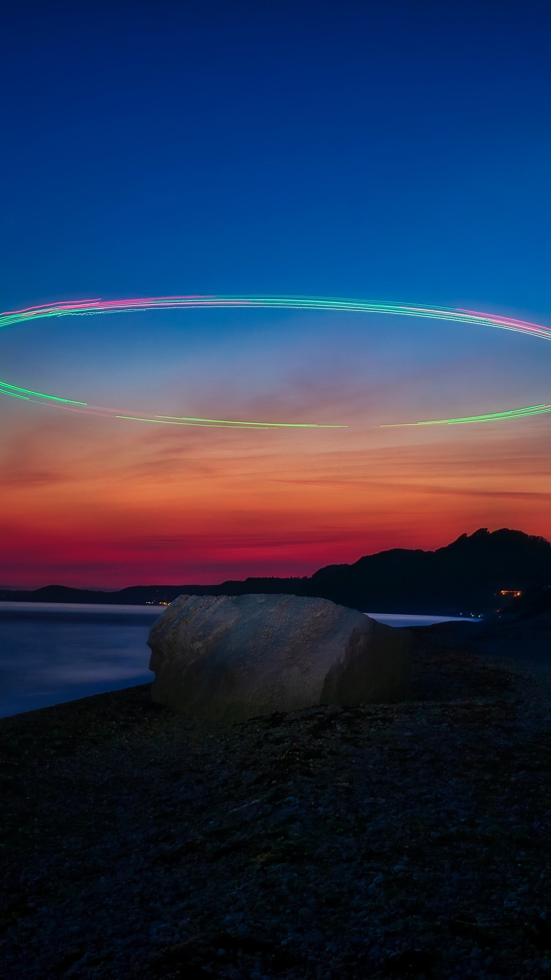Sunset over the ocean with light trails HD Phone Wallpaper