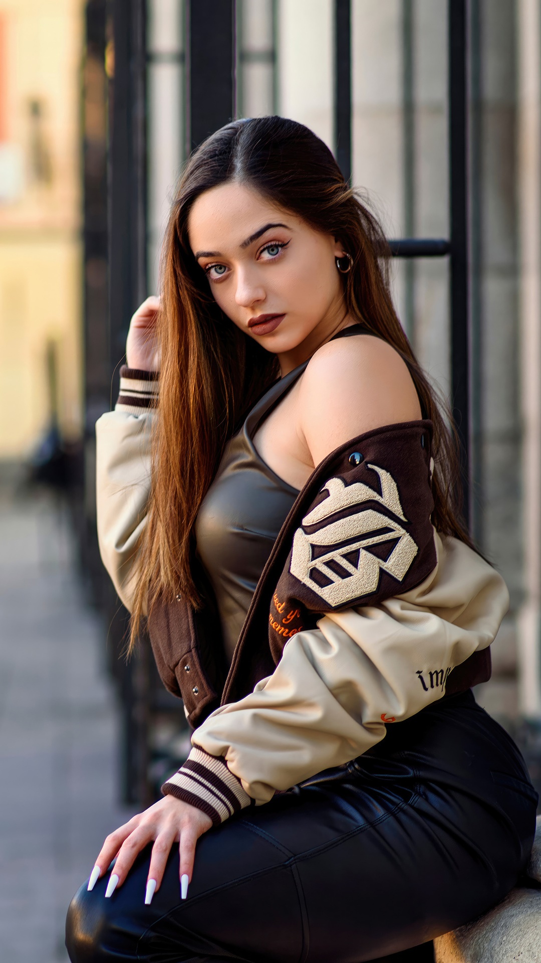 Model in a bomber jacket and leather pants HD Phone Wallpaper